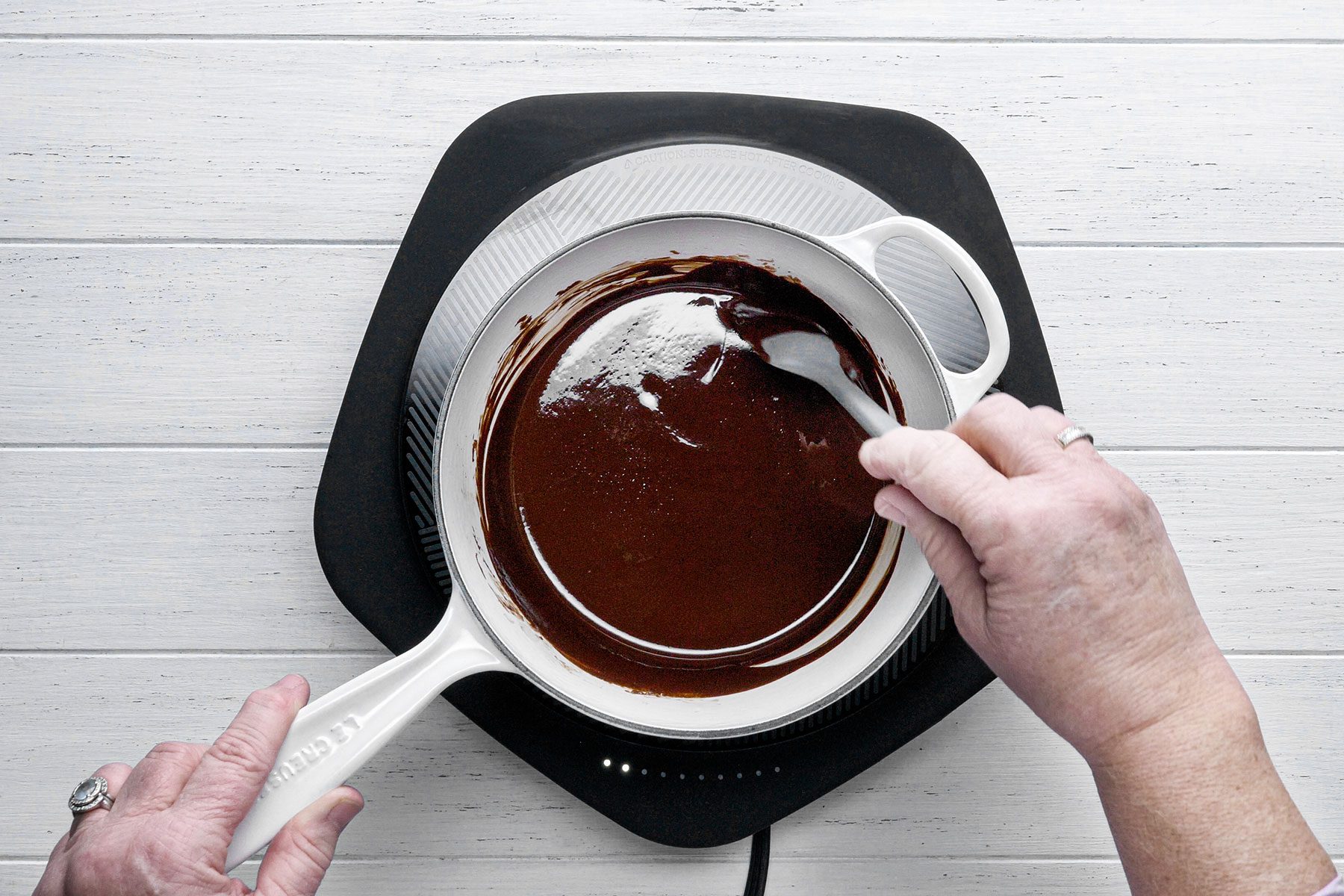 Melting chocolate in sauce pan over heat