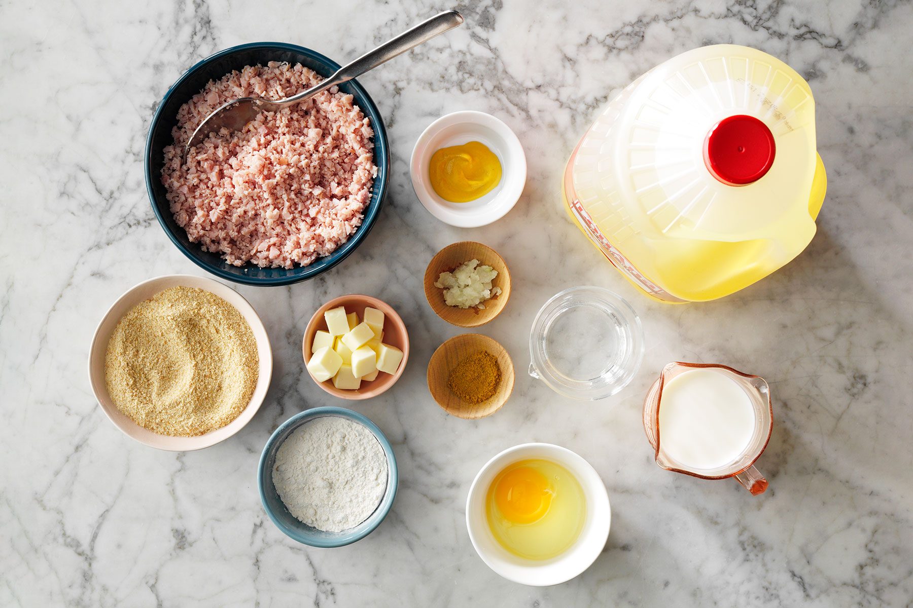 Ingredients for Ham Croquettes on marble surface