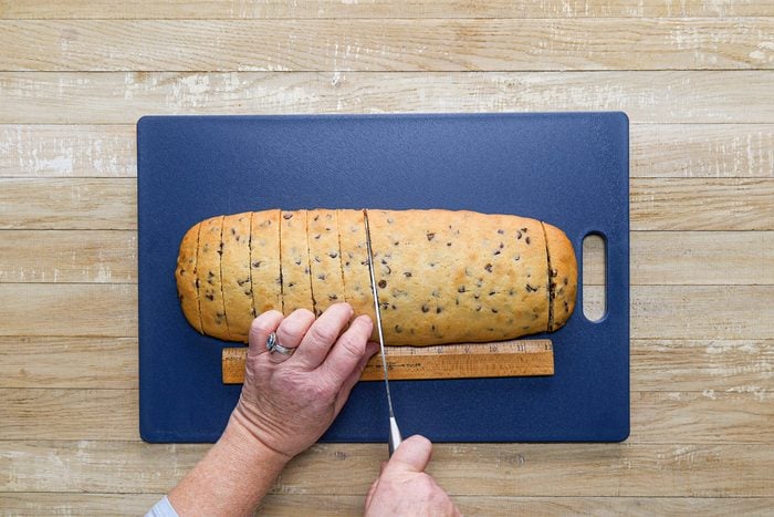 A person Slicing Bread with knife