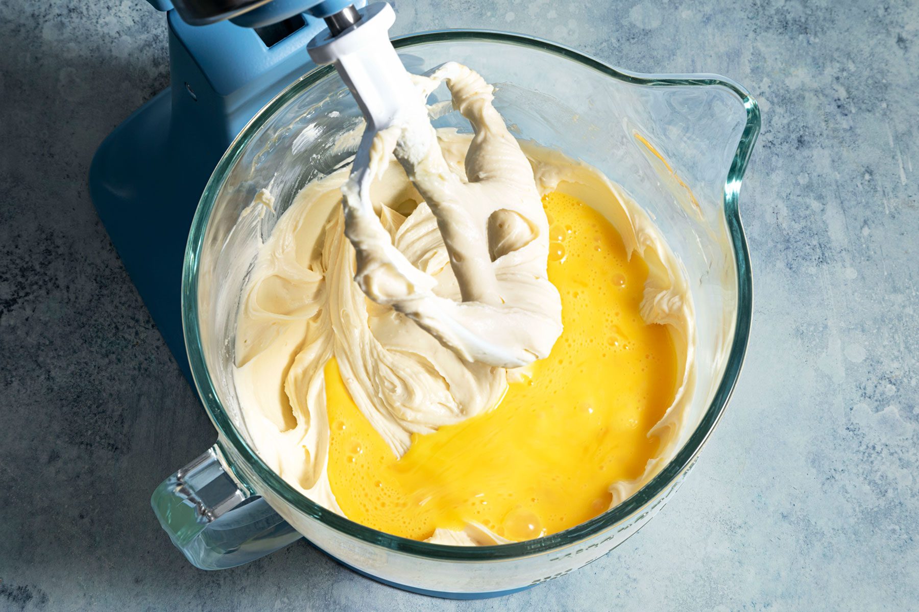 Blending eggs in the mixture 