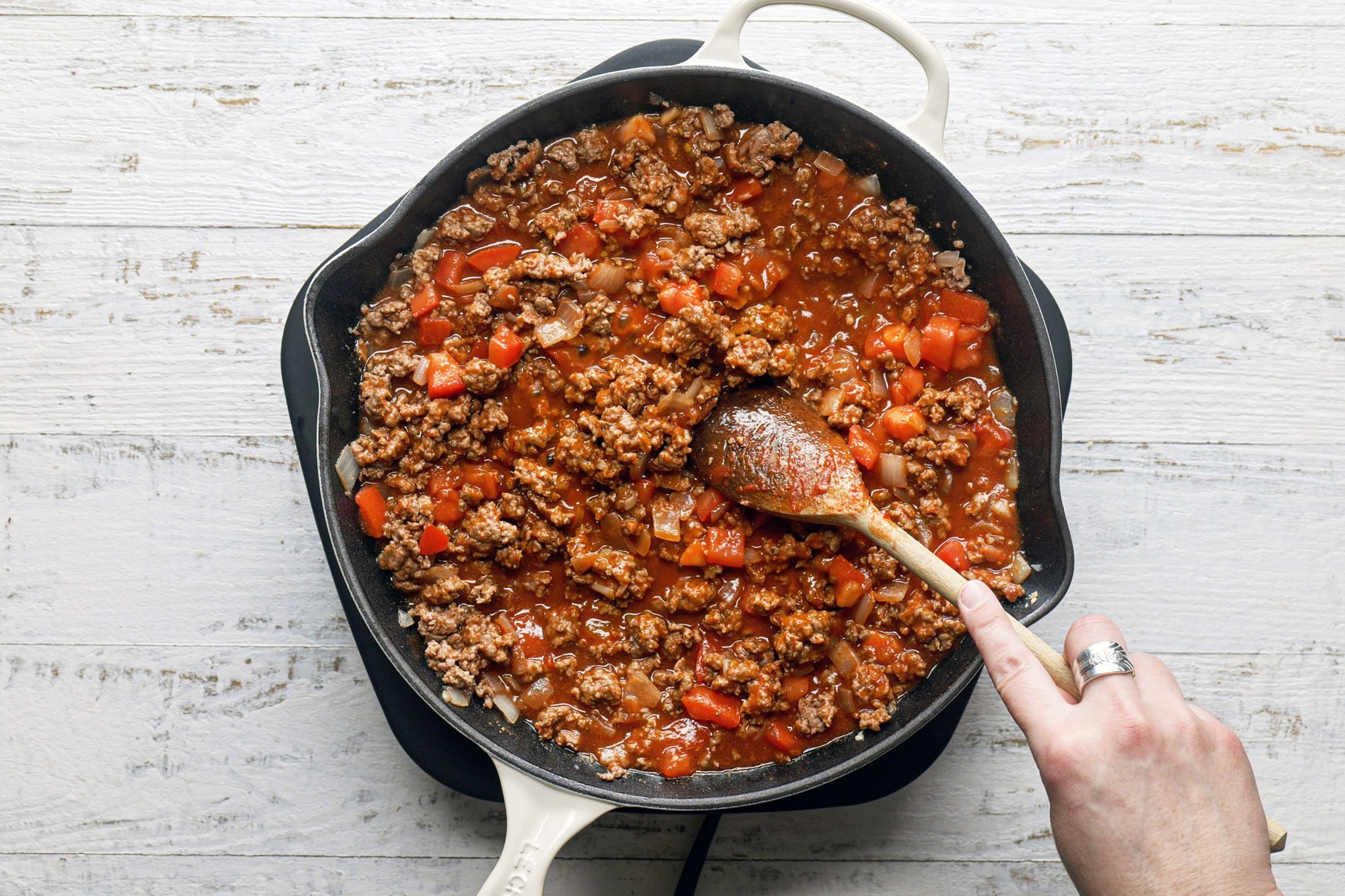 Cook the lamb with onion and garlic in a large skillet