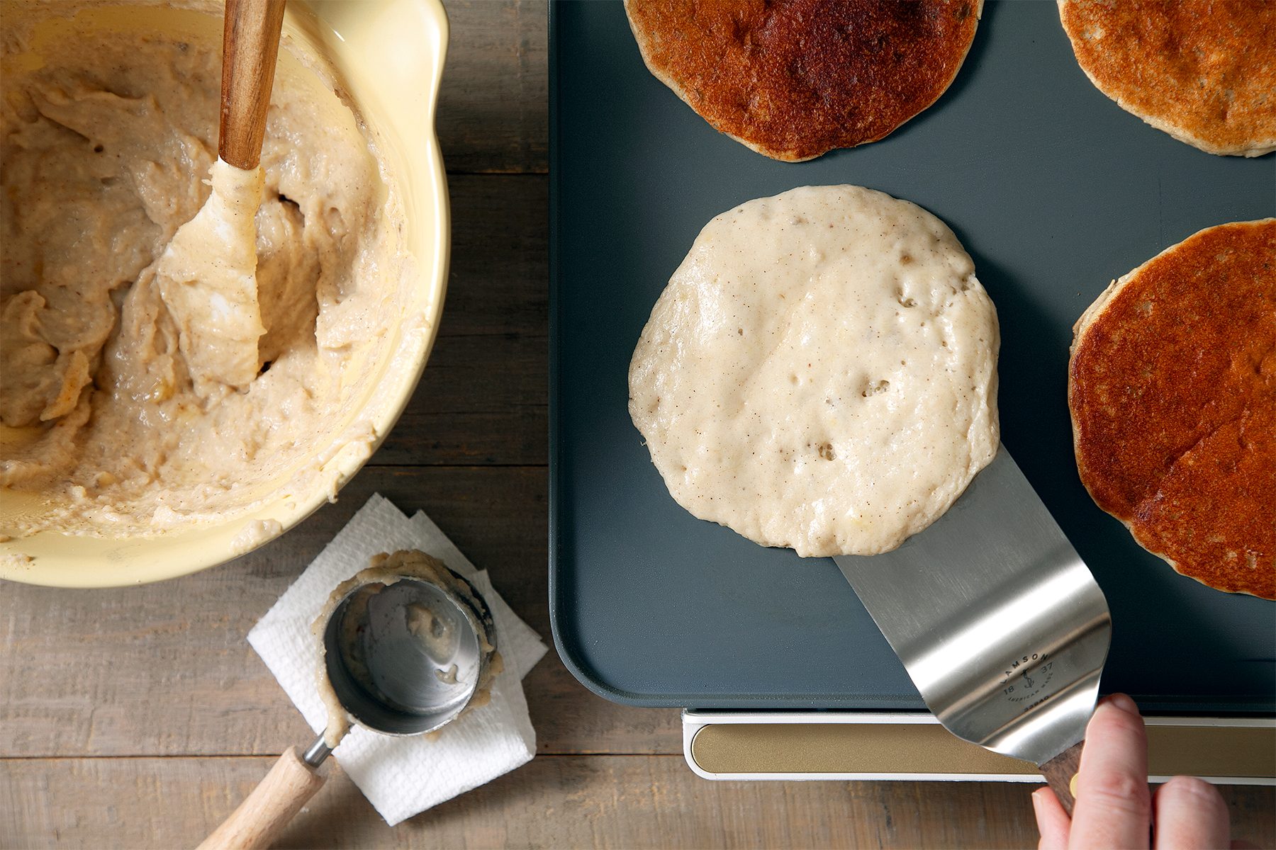 A person cooking pancakes
