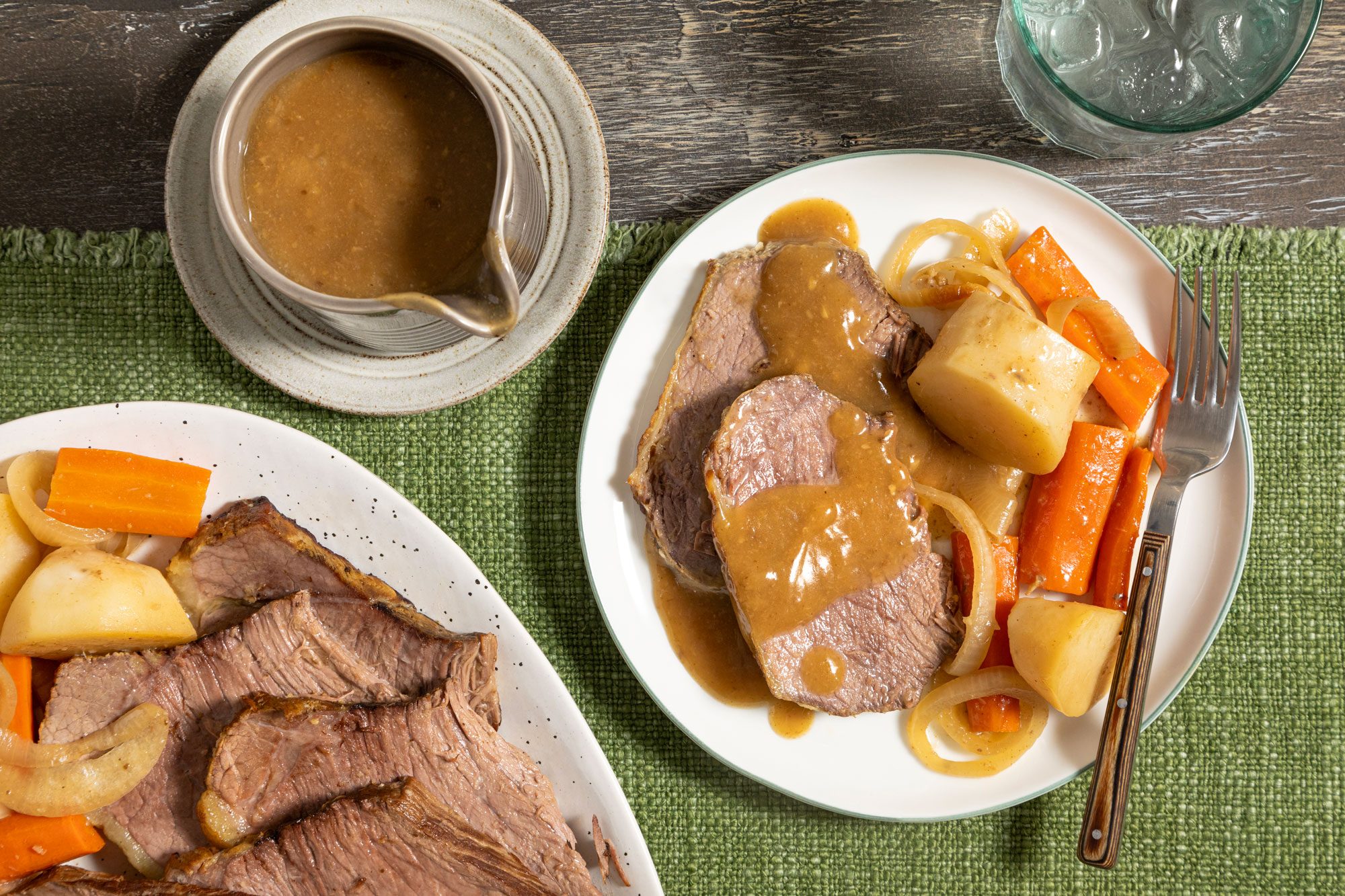 Slow Cooker Rump Roast Served in a Plate on a Green Jute Cloth on a Wooden Surface