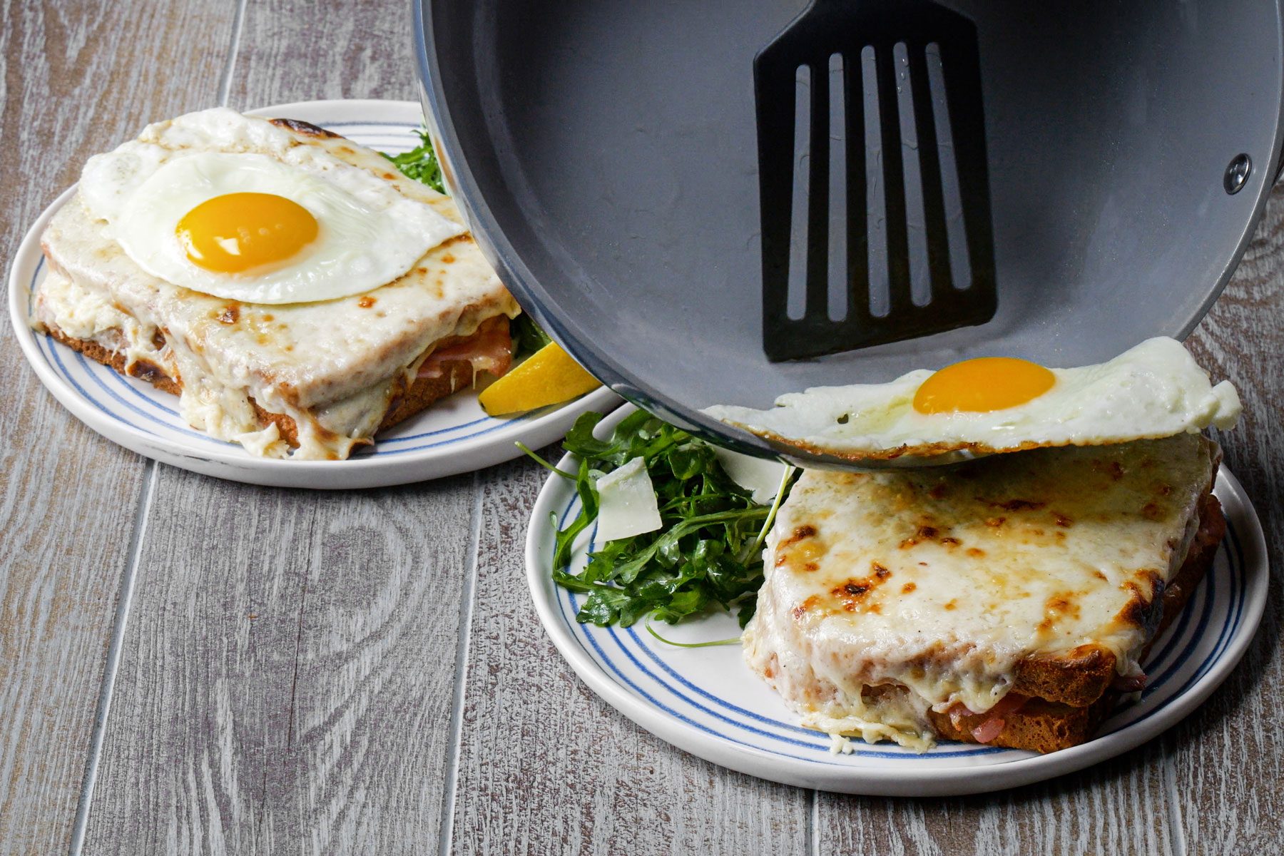 Topping the sandwich with fried eggs