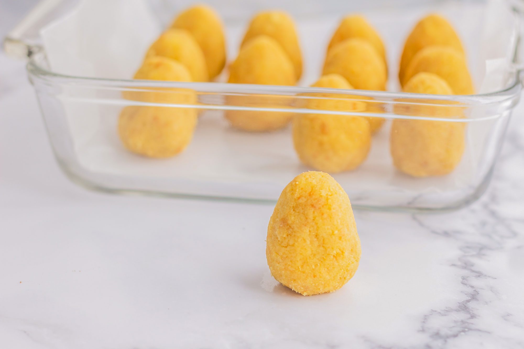 Place the egg shaped cake into a dish