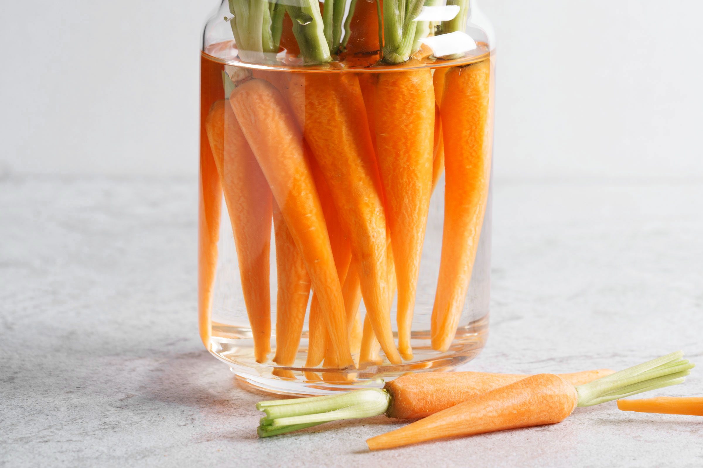 peeled carrots in water
