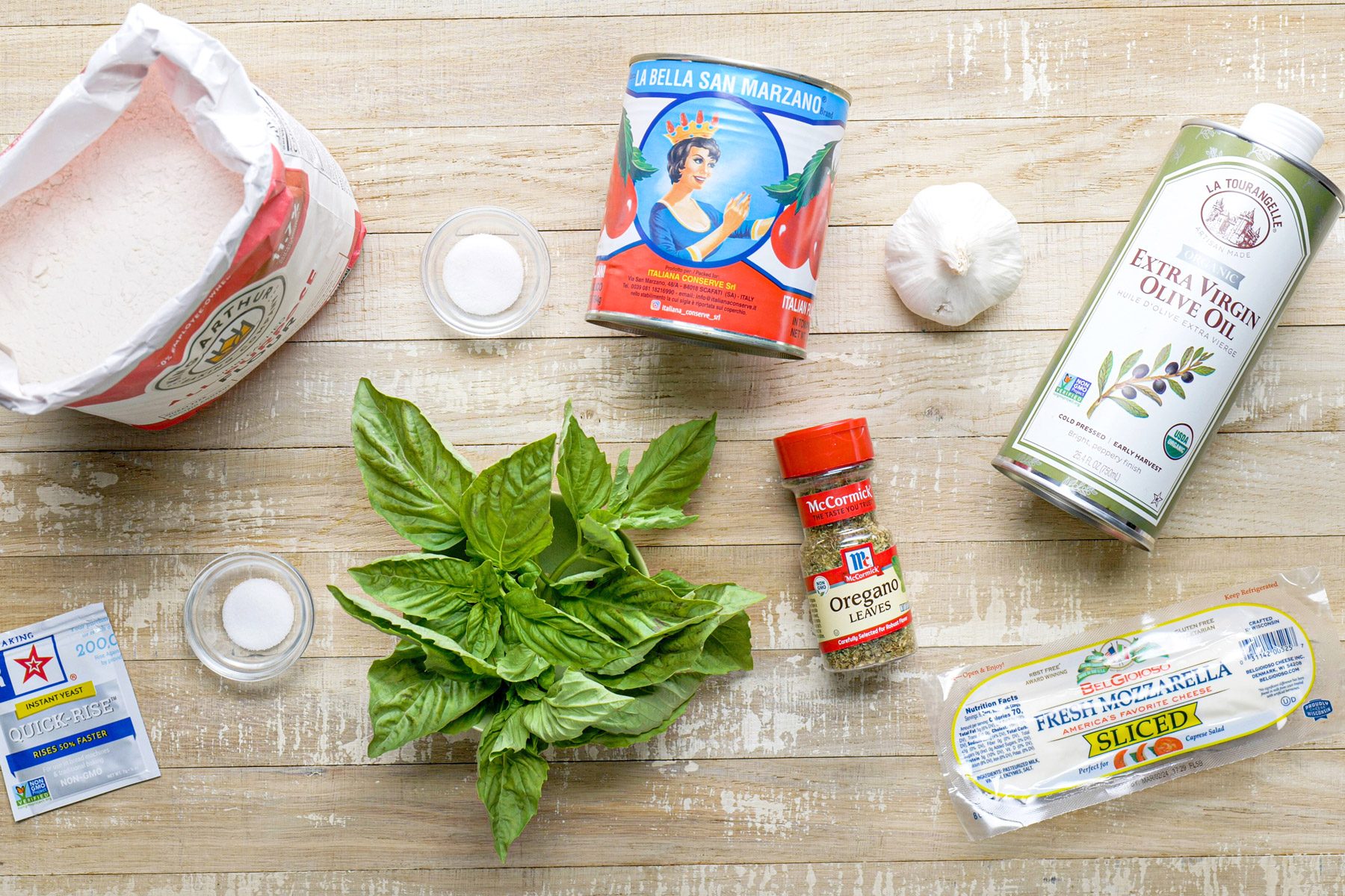 Margherita pizza ingredients on a table