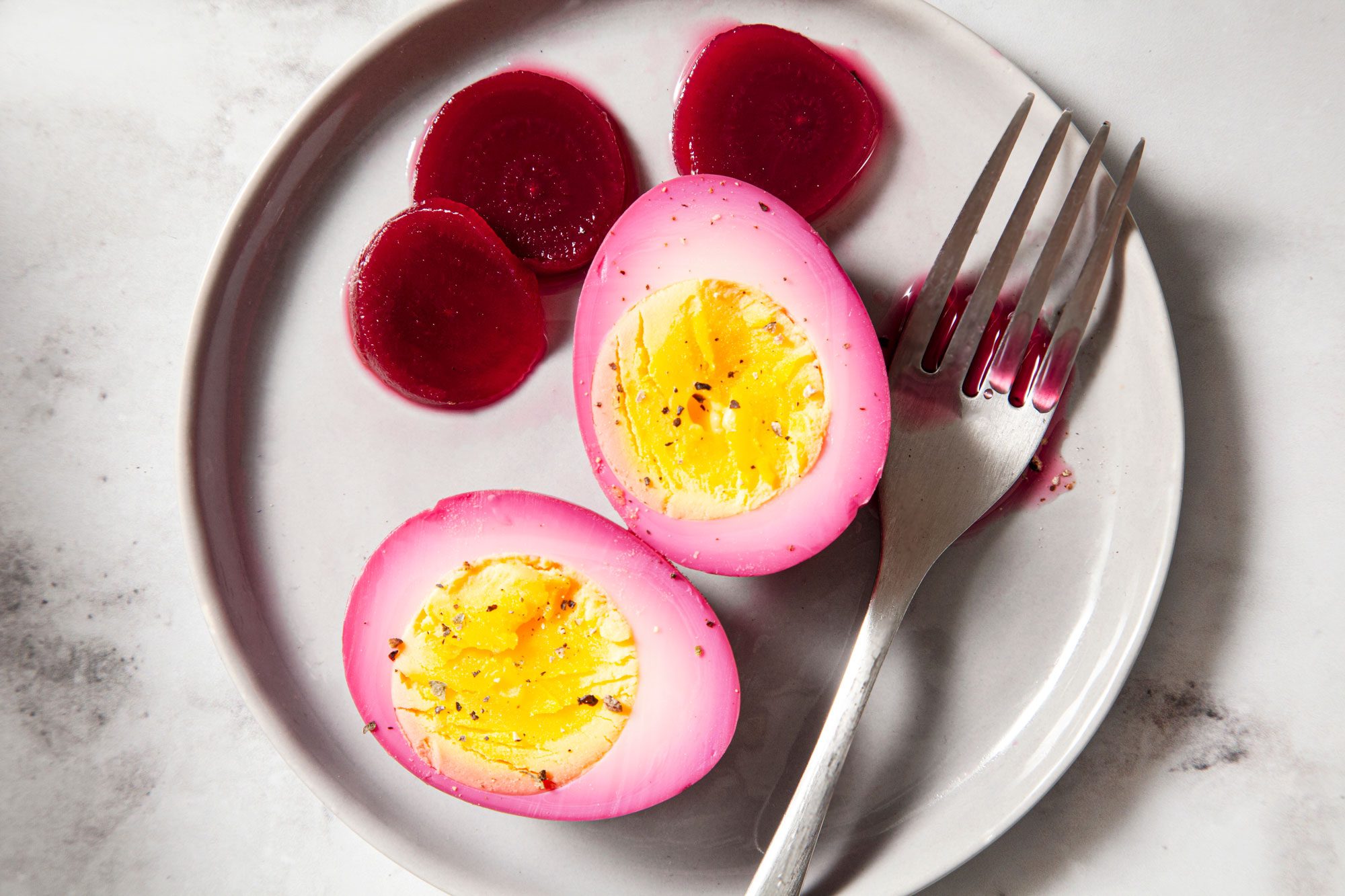 Pickled Eggs And Beets Served in a Small Plate on Marble Surface
