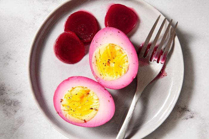 Pickled Eggs And Beets Served in a Small Plate on Marble Surface