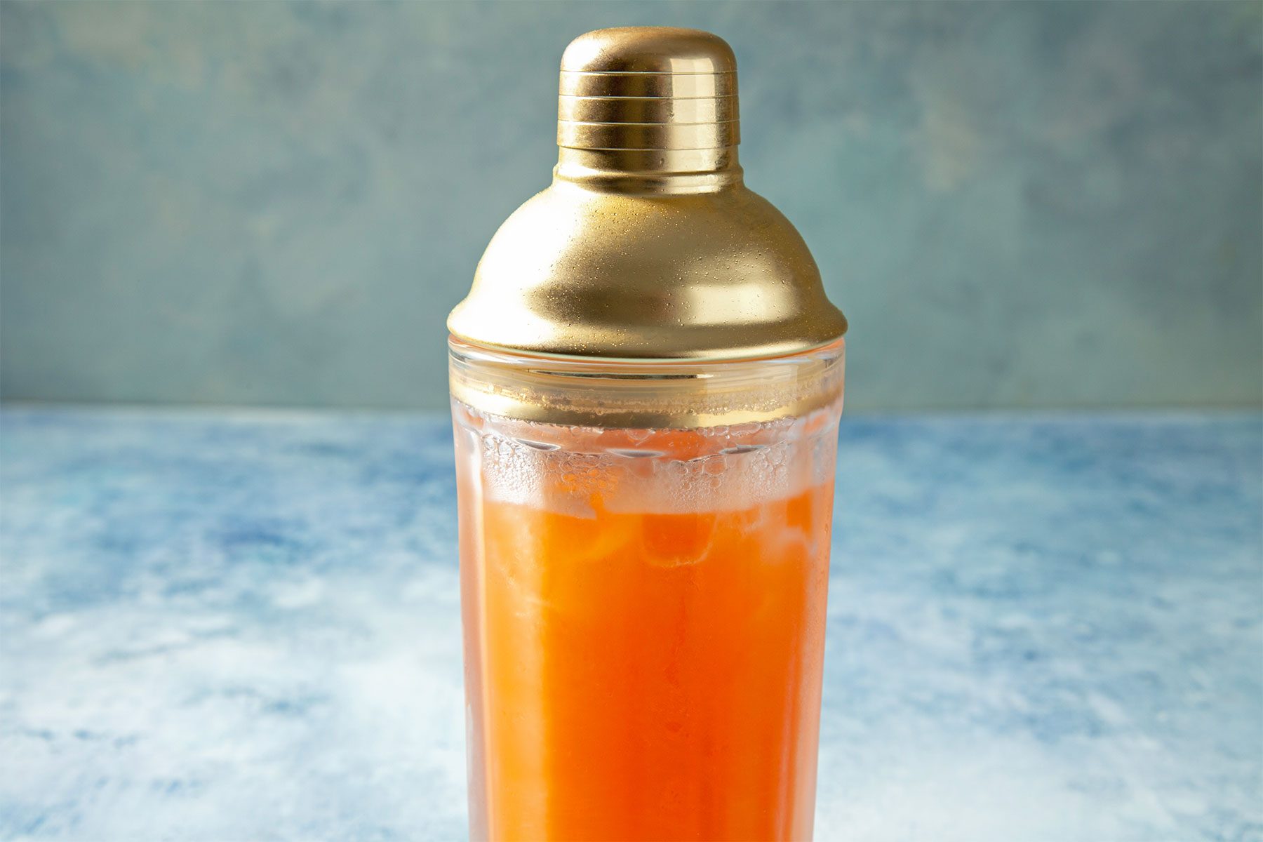 wide shot of shaker filled with sweet rum punch