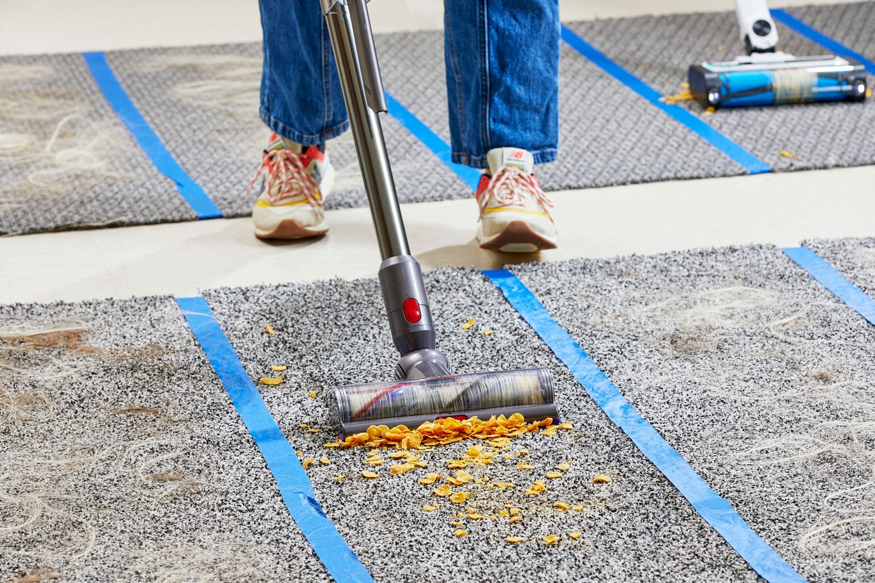 Cleaning the carpet with a Dyson vacuum
