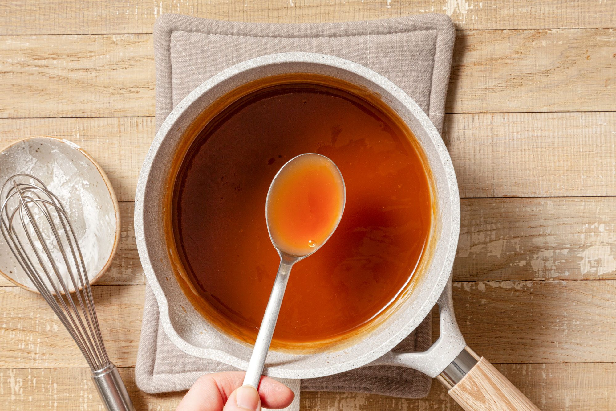 Slurry for Shrimp Egg Foo Young in a Saucepan on Wooden Surface