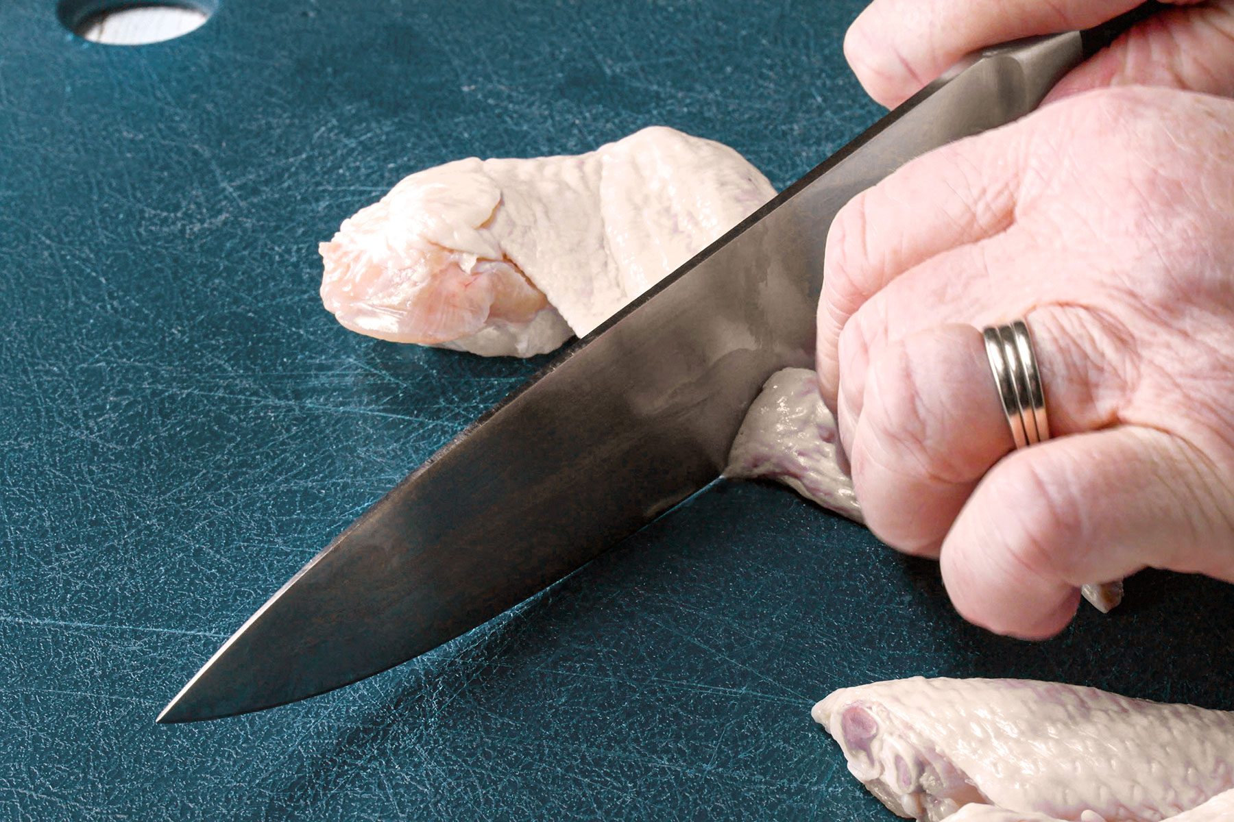 Chopping chicken pieces
