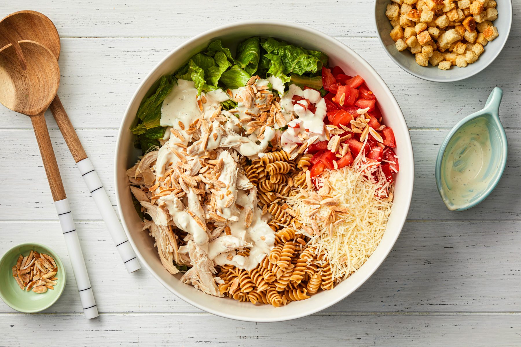 A bowl of pasta with cheese and vegetables