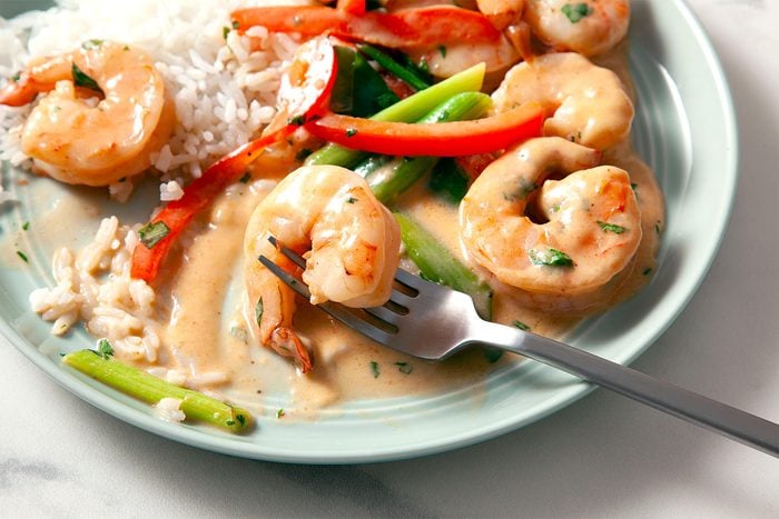 Coconut Curry Shrimp served with rice on plate