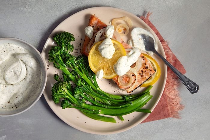 Dill Sauce For Salmon served on lemon slices and other vegetables
