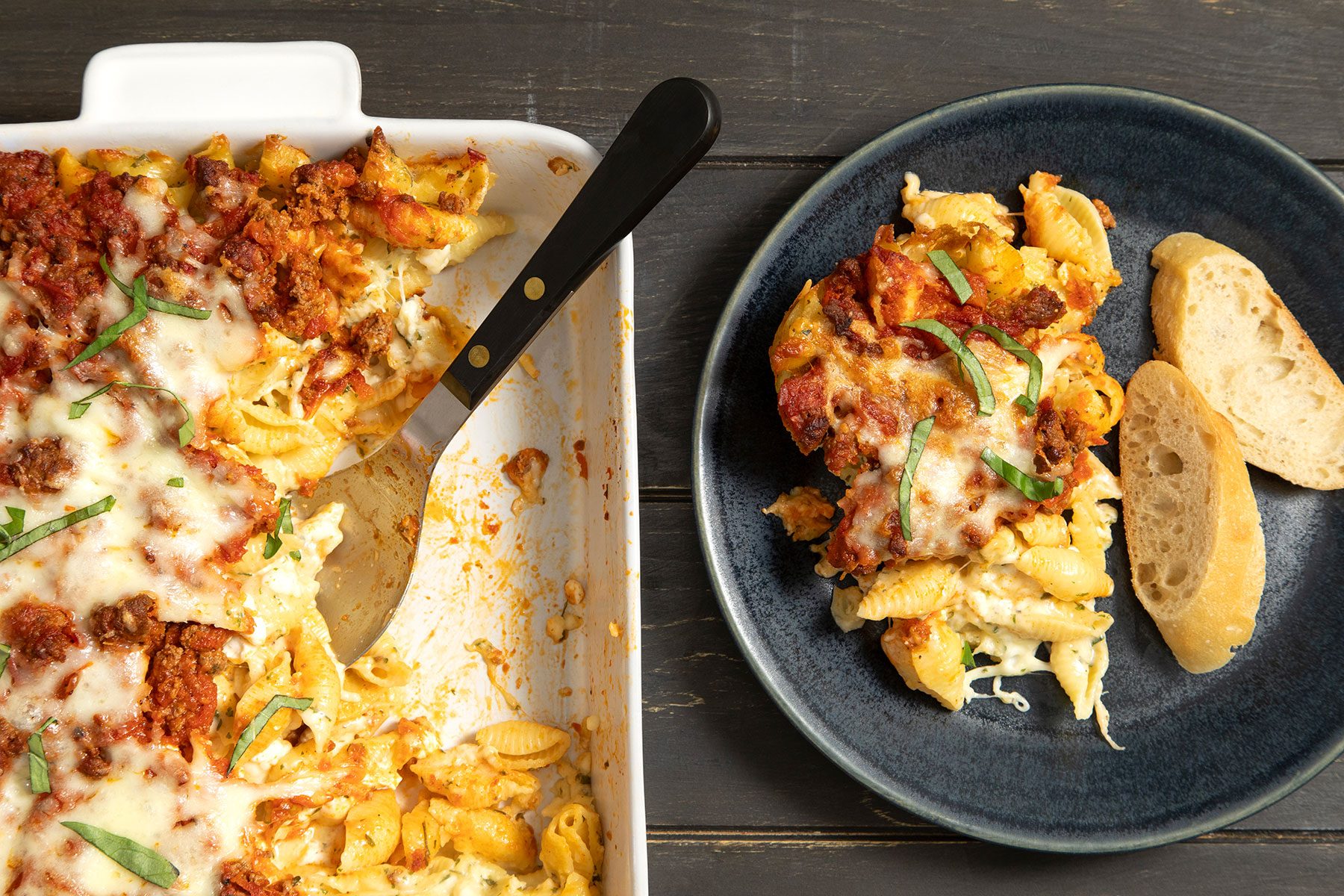 Lasagna Casserole served on plate with breads 