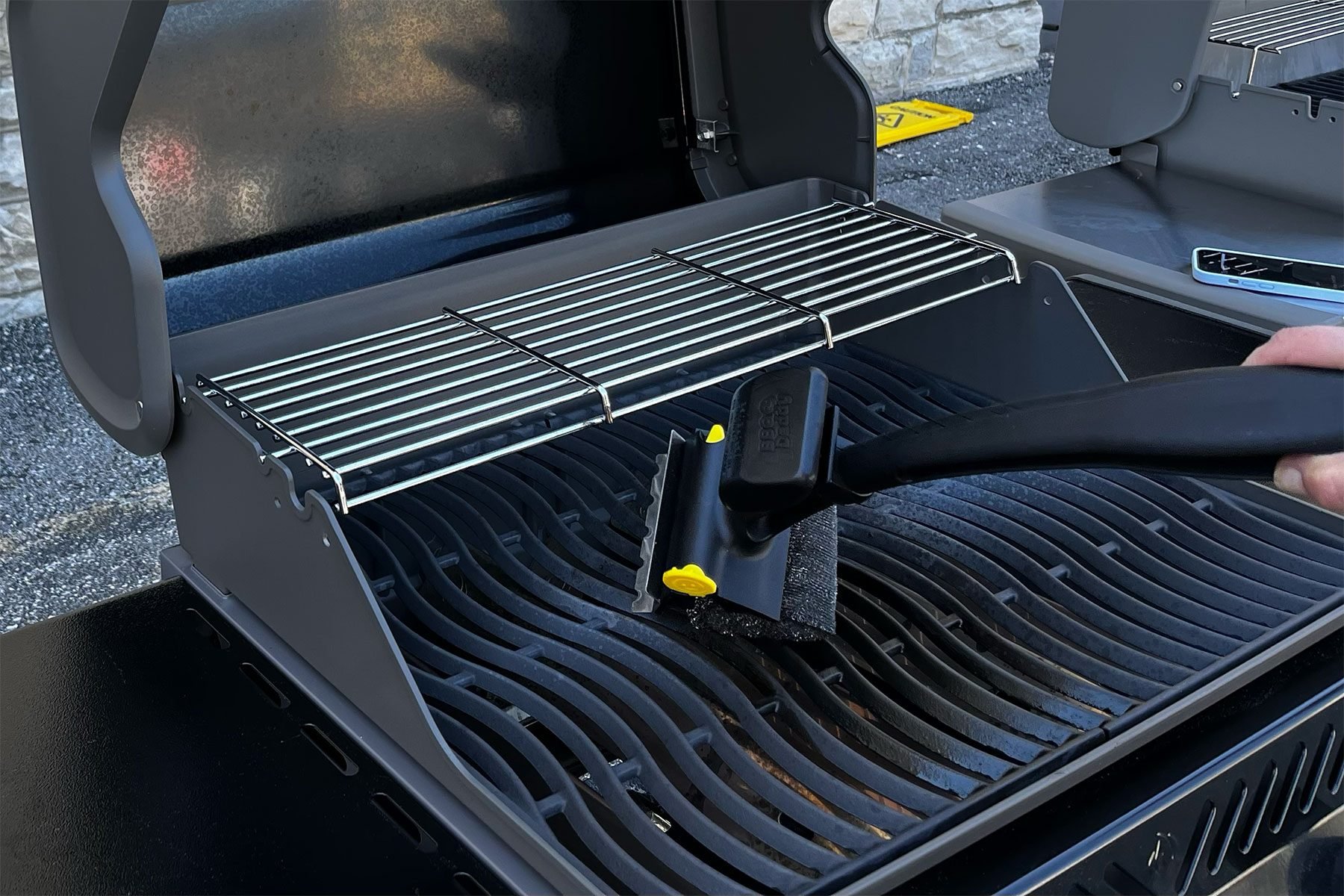 Using BBQ Daddy Scrub to clean grill