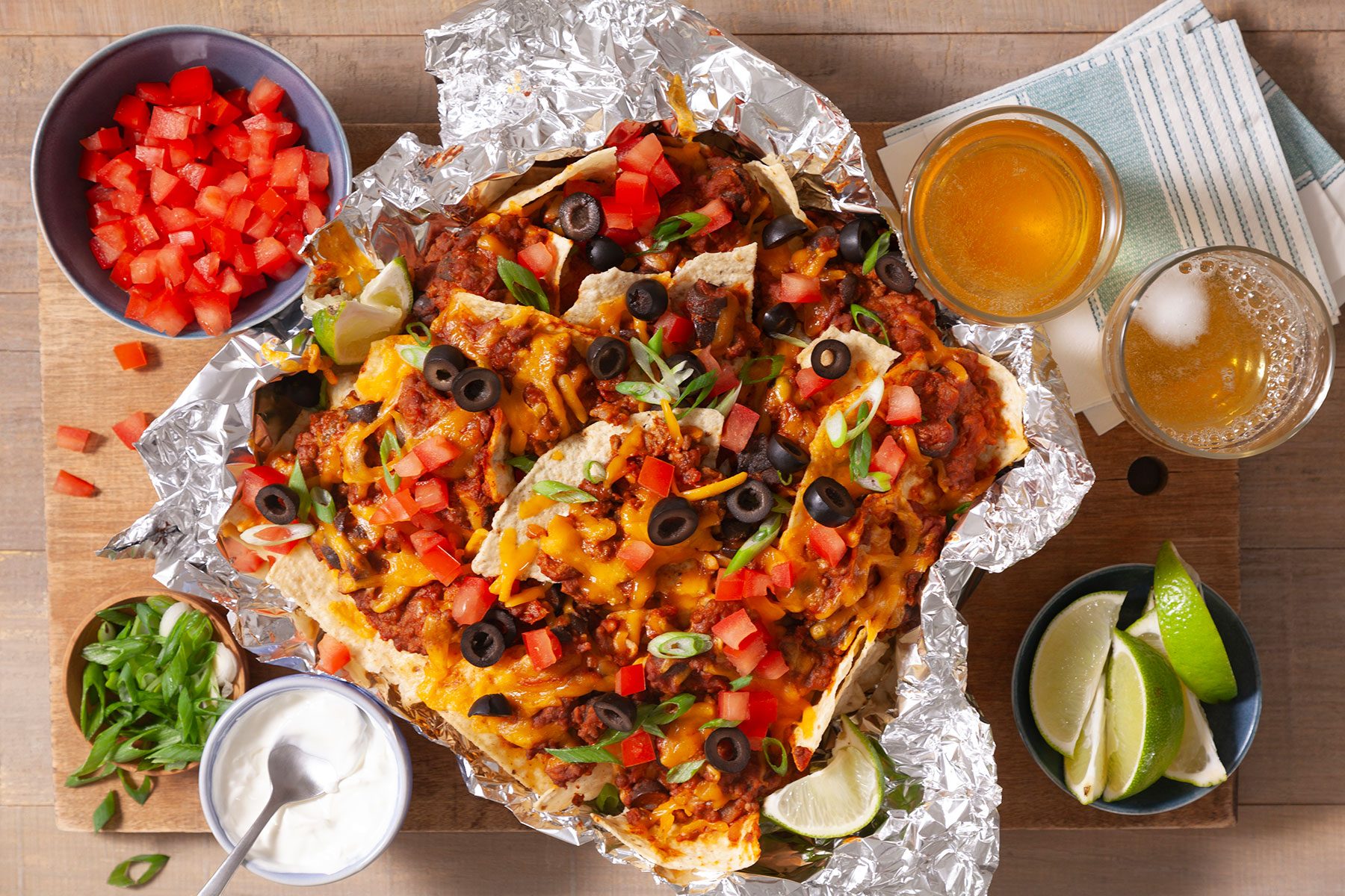 Top Shot of Air Fryer Nachos served with dips and sauces