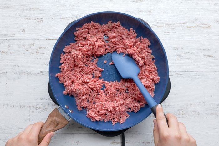 overhead shot of crumbled beef in a large skillet