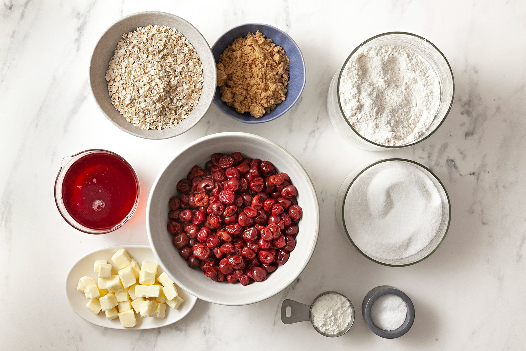 overhead shot; white background; Cherry Crisp ingredients placed over background