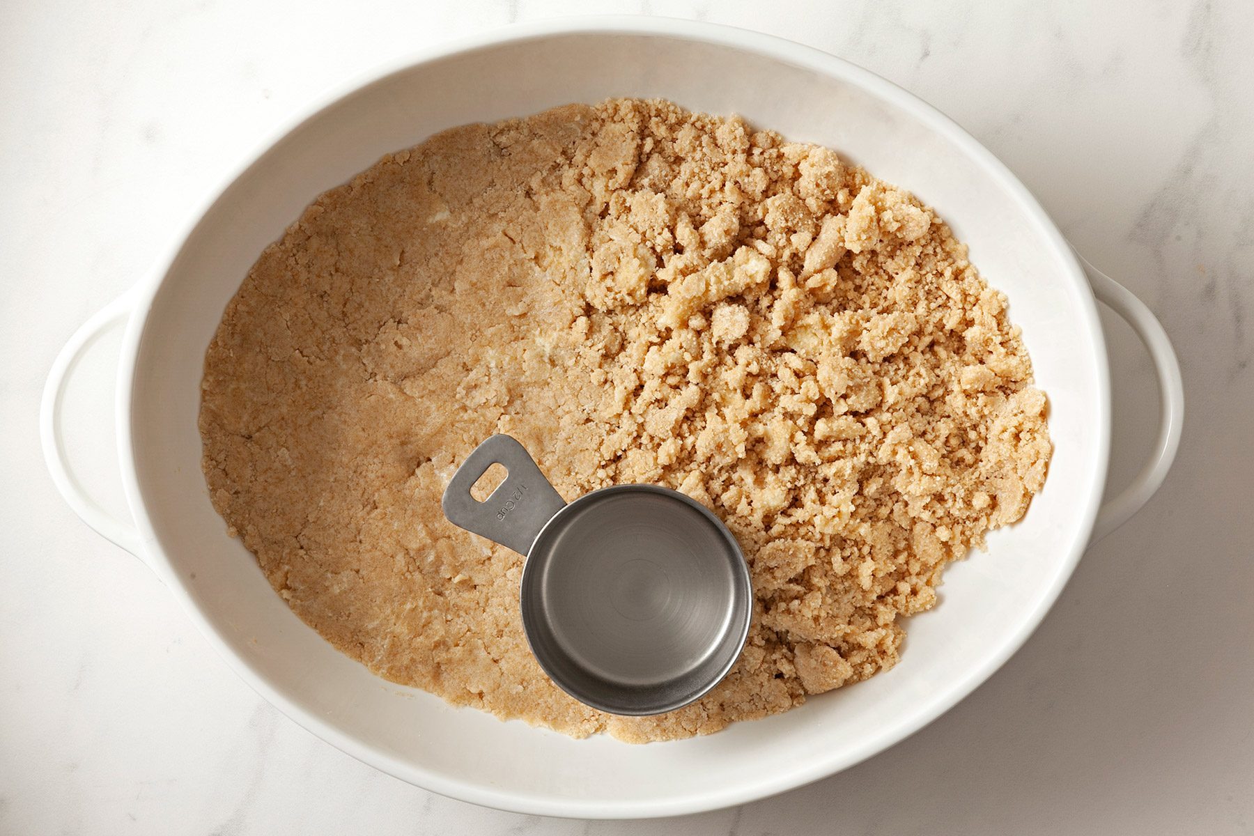 overhead shot; white background; sugar and cornstarch in a saucepan.