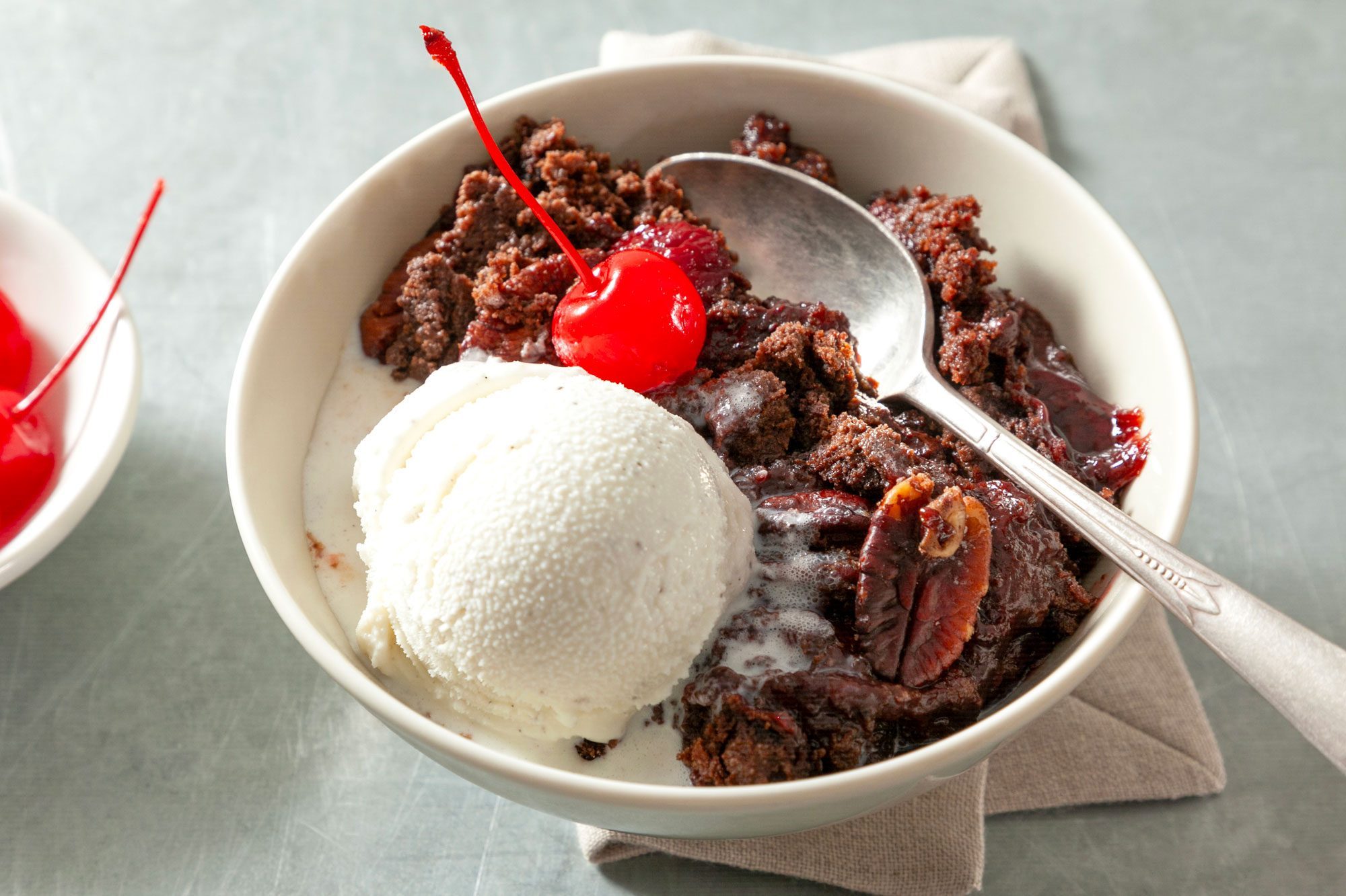 Chocolate cherry dump cake served with ice cream and cherry