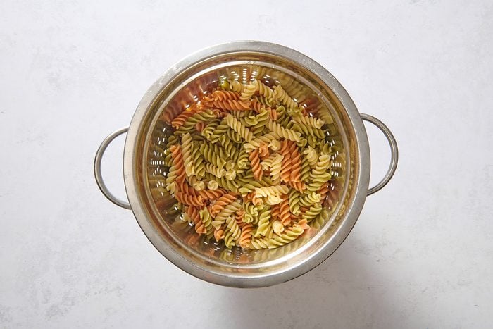 Pasta draining in a colander