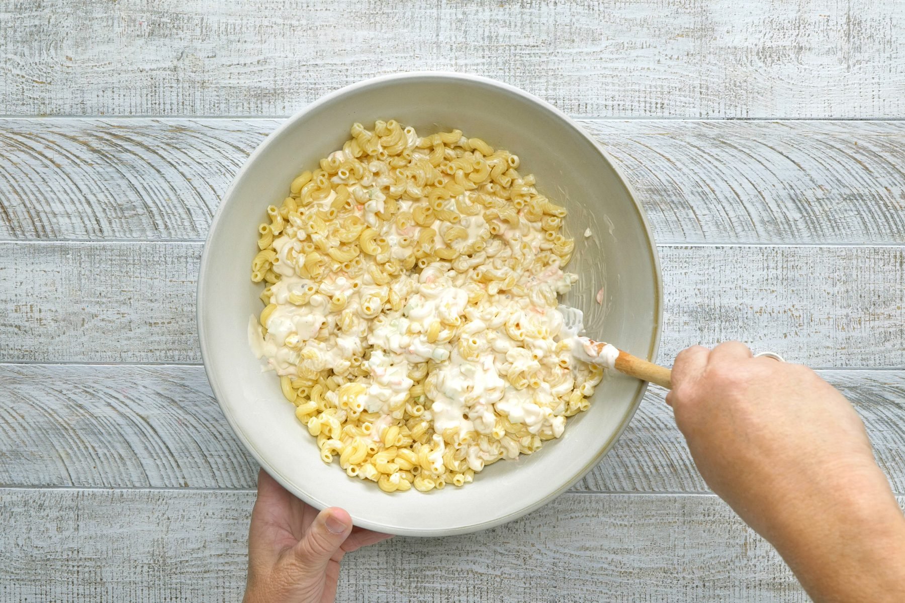 Gently toss the dressing and the macaroni