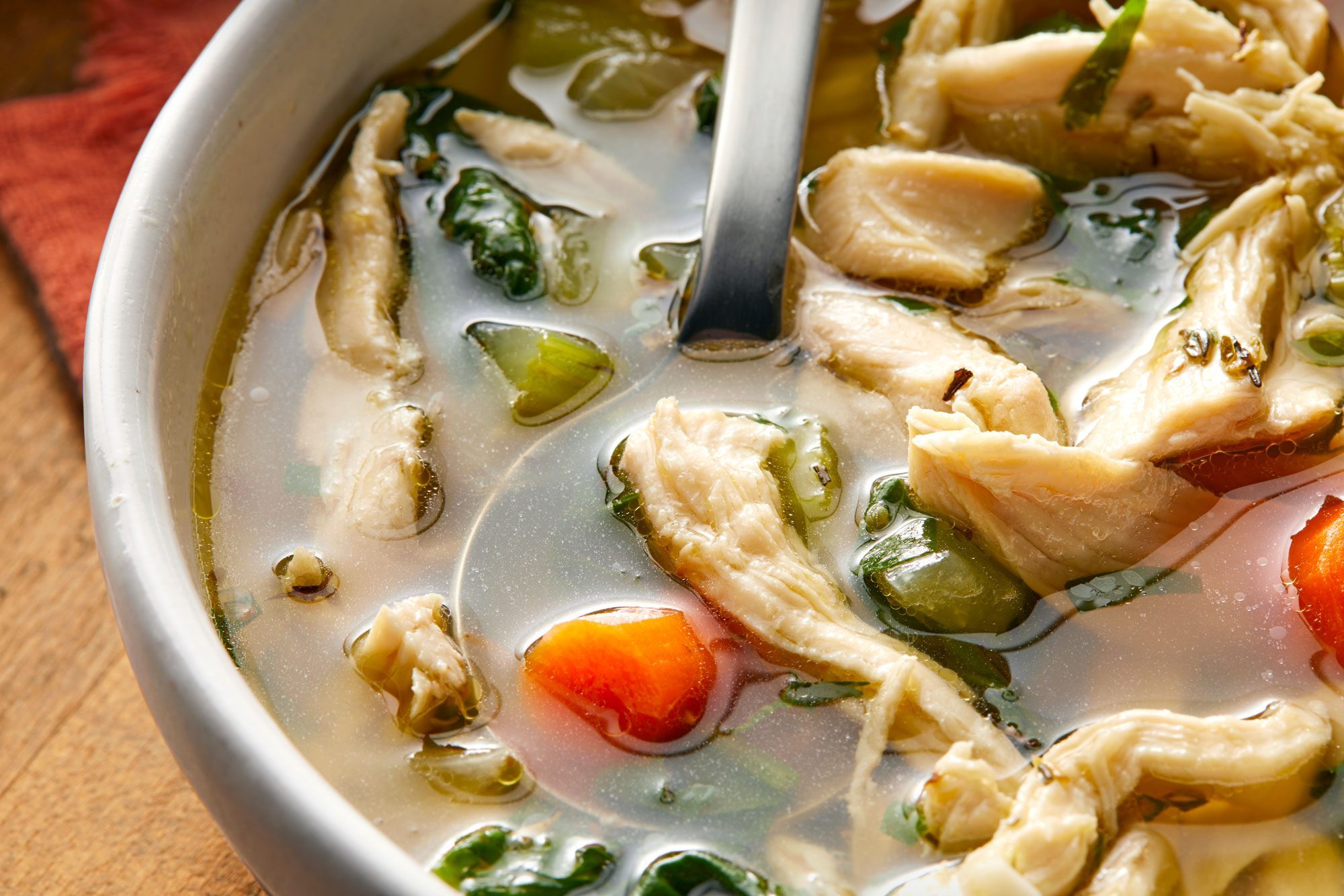 close shot of keto chicken soup served in a bowl