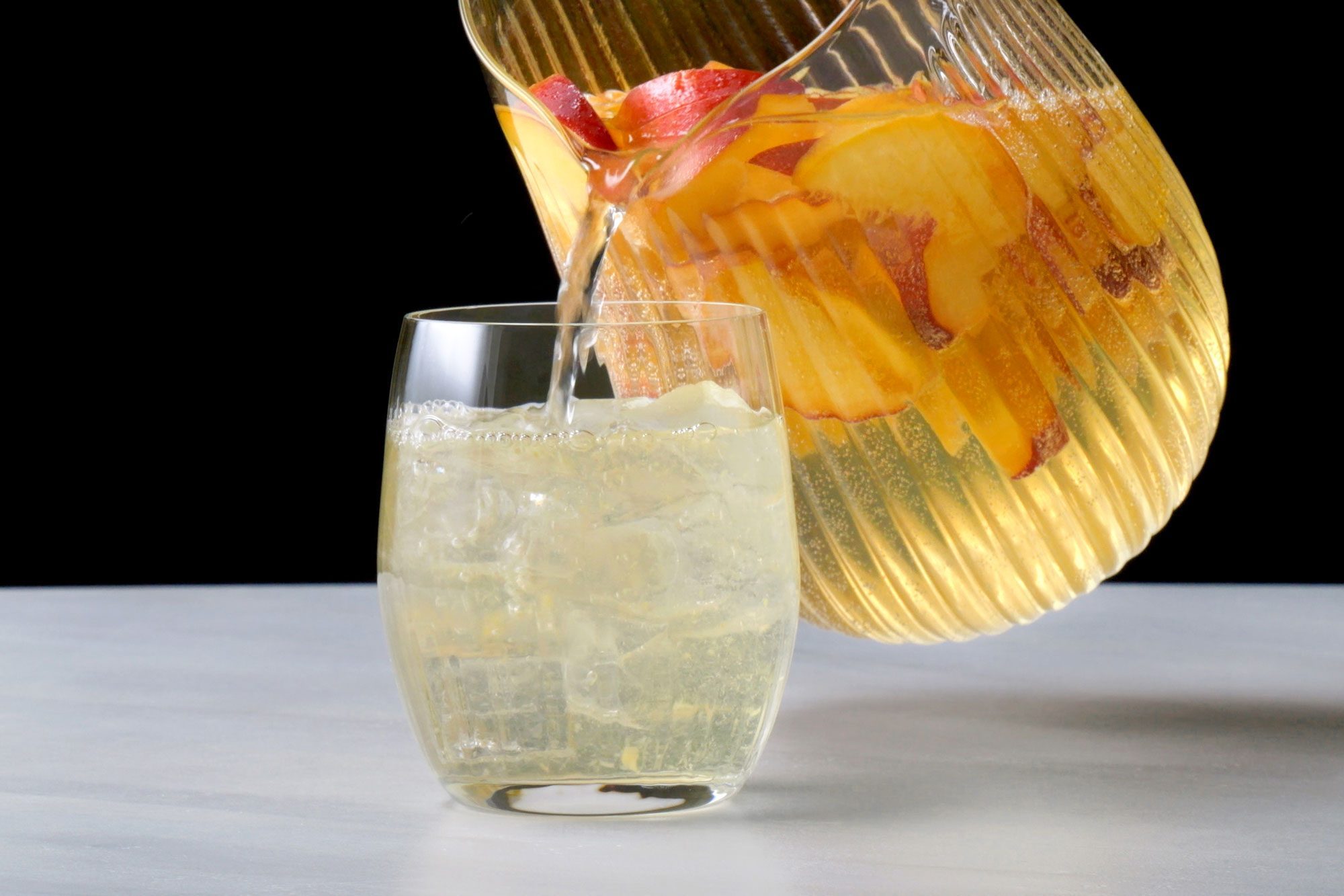 Serving Peach Sangria in a glass