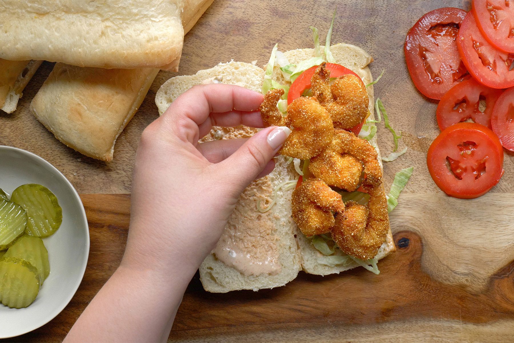 overhead shot; white background; Shrimp Po'Boys served on rectangular tray