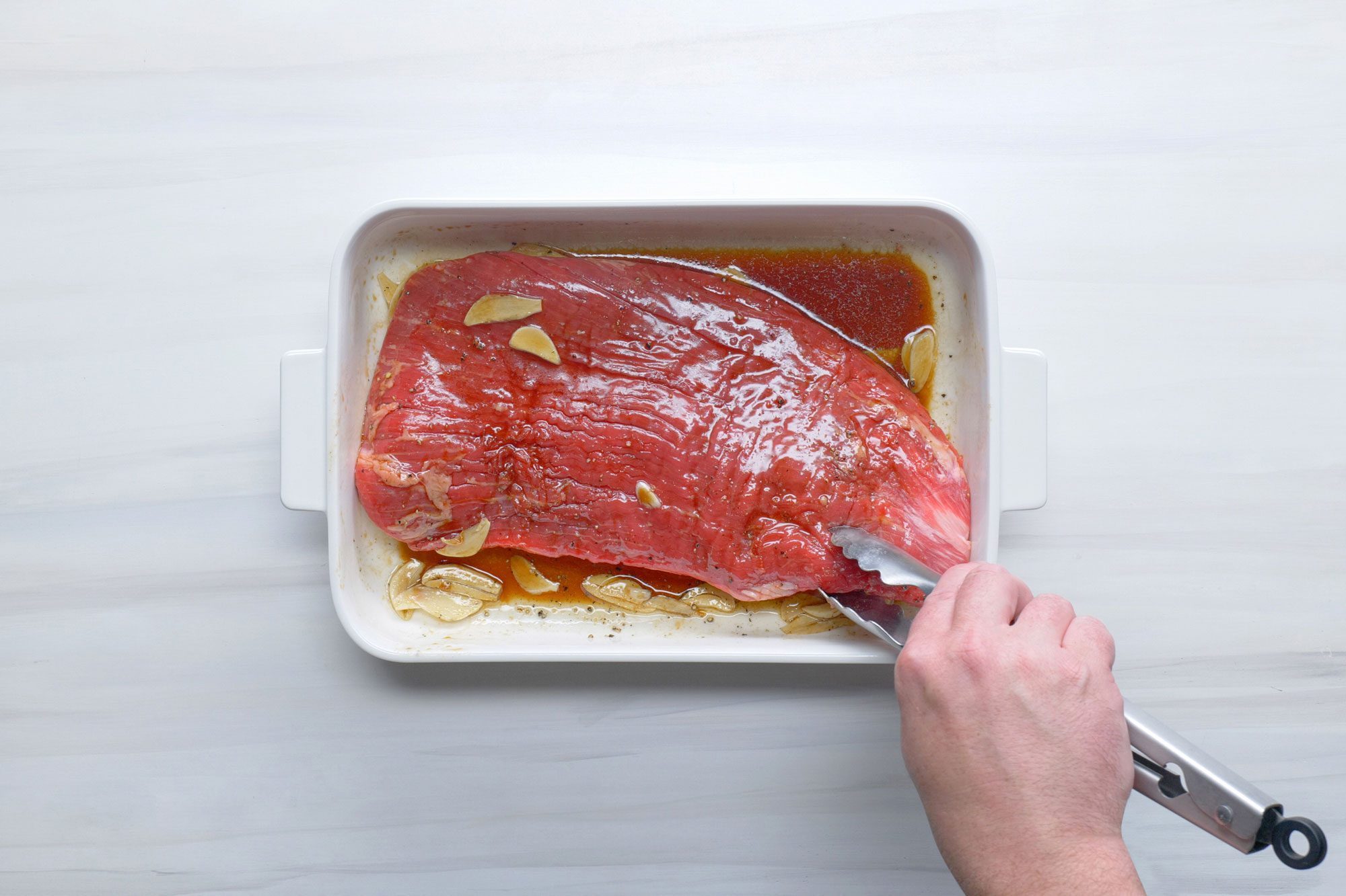 Add the steak and turn to coat it with the marinade