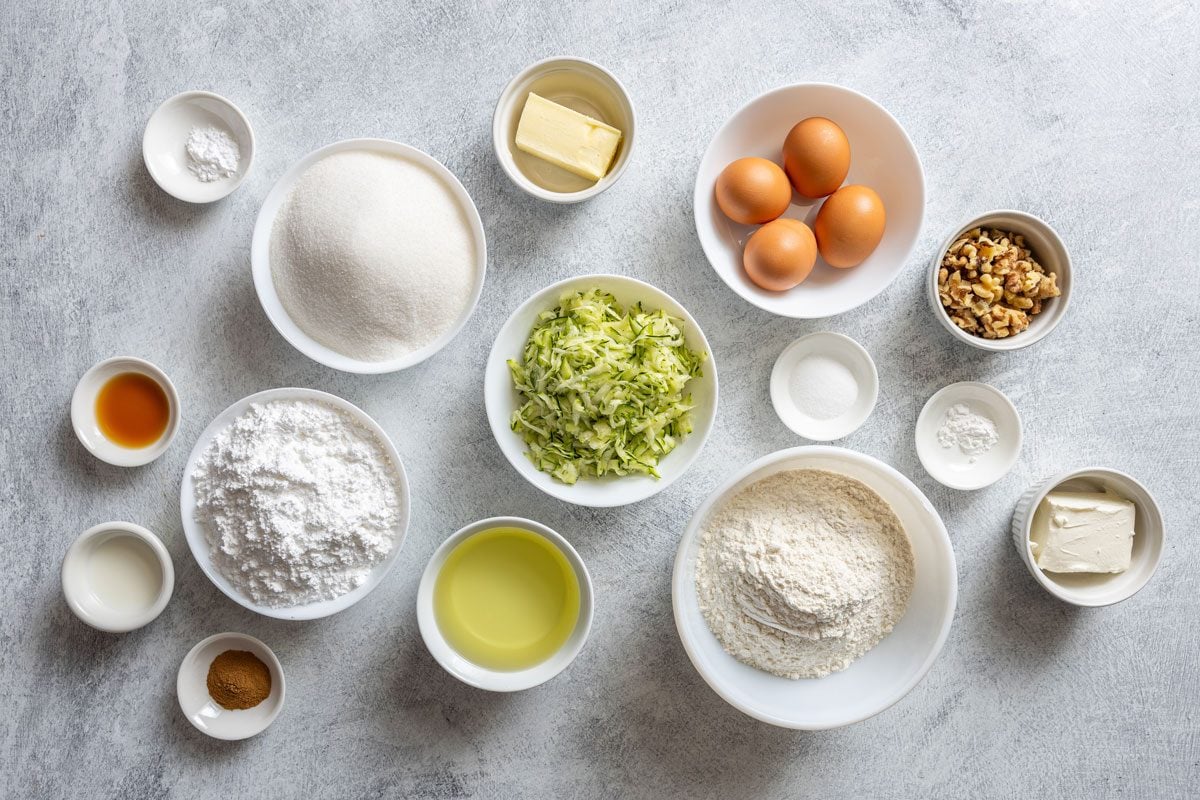 Zucchini Cake Ingredients laid out in bowls on a kitchen counter