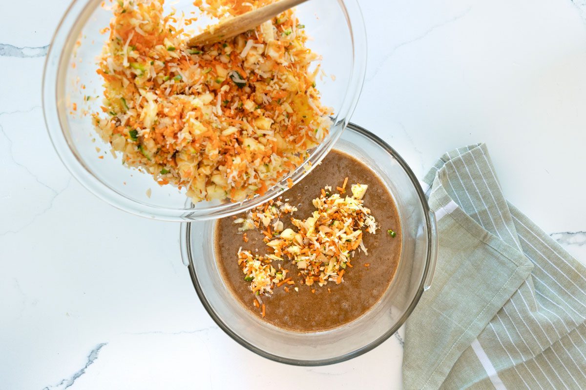 Mixing The Fruits Into The Batter for zucchini carrot muffins