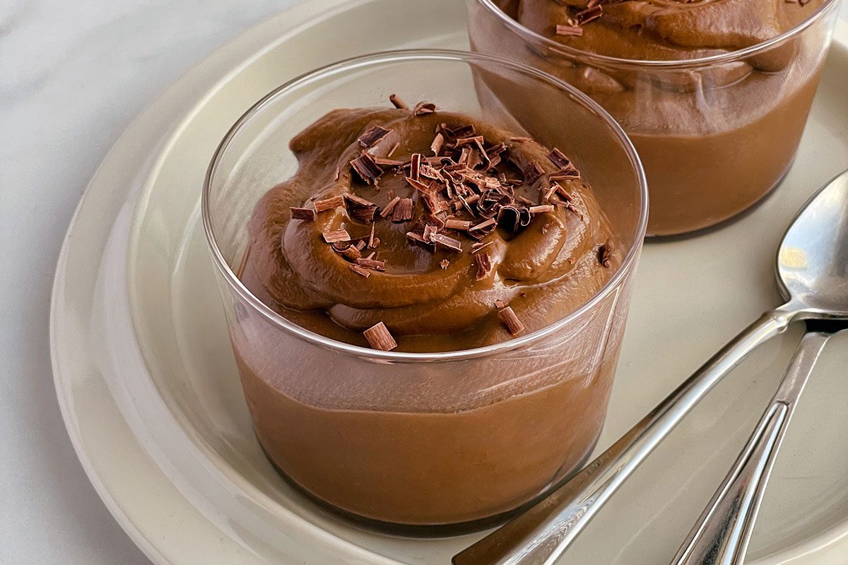 Close up of Avocado Chocolate Mousse on a white background