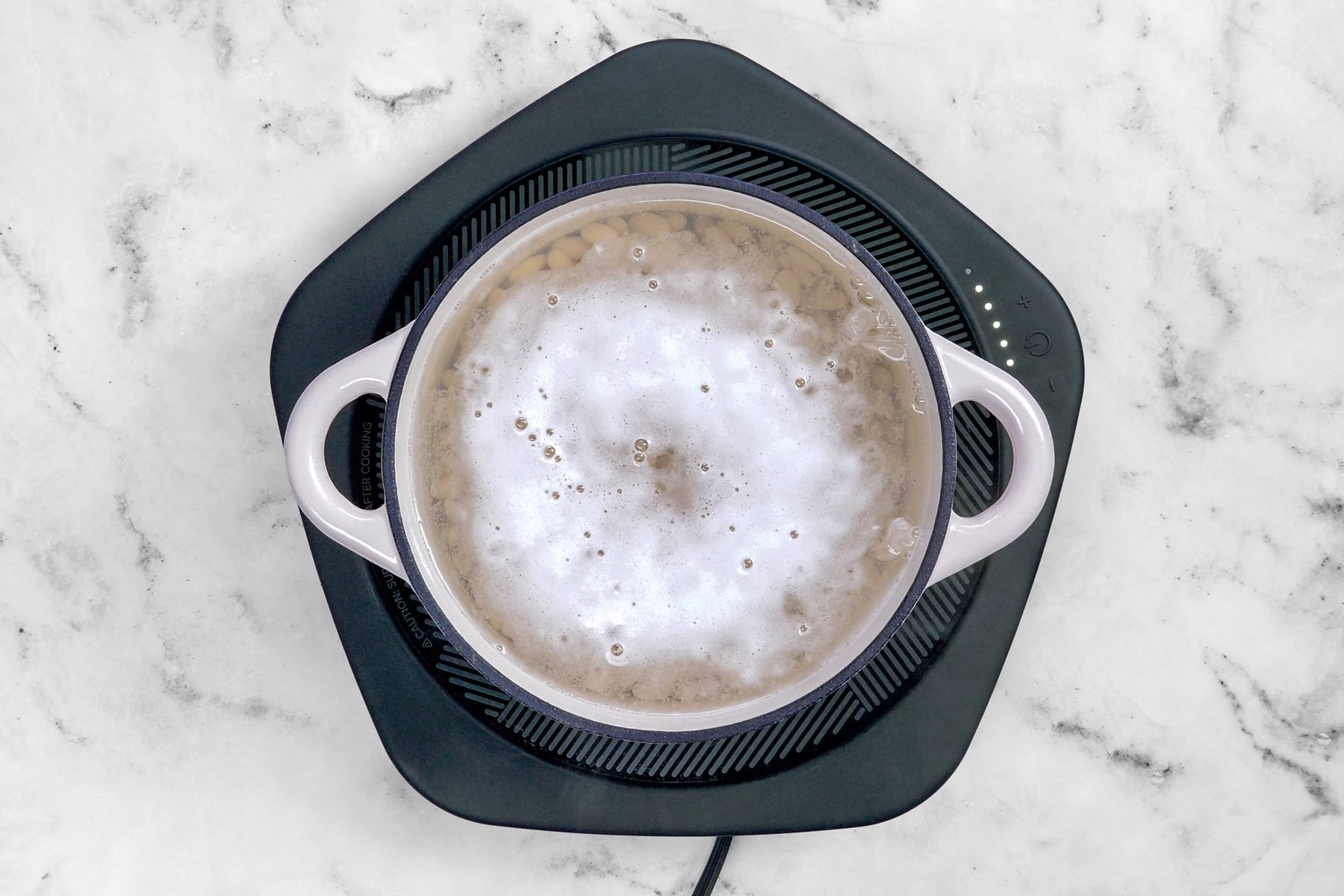 Boil the beans on simmer to make them tender