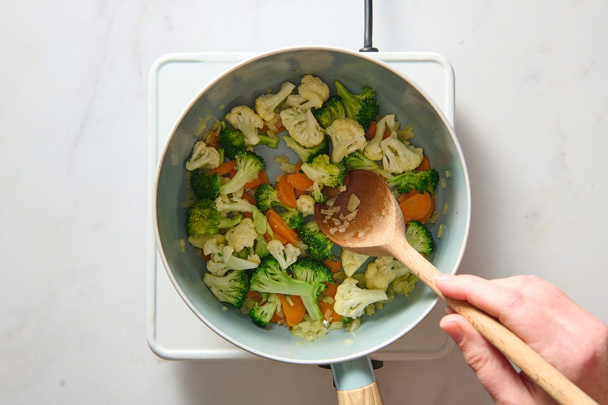 Cooking the vegetables in a saucepan