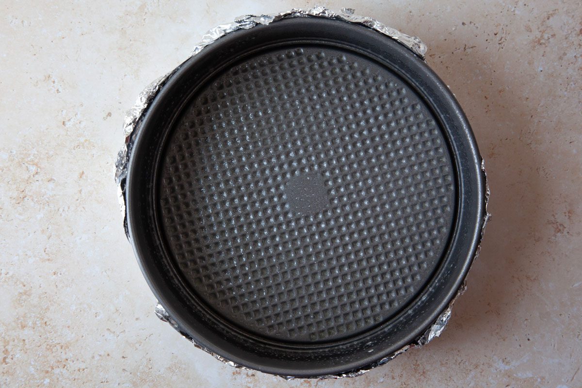 Step 1 of Taste of Home Caramel Apple Cheesecake is o wrap the pan with a double thickness of foil to create a water barrier