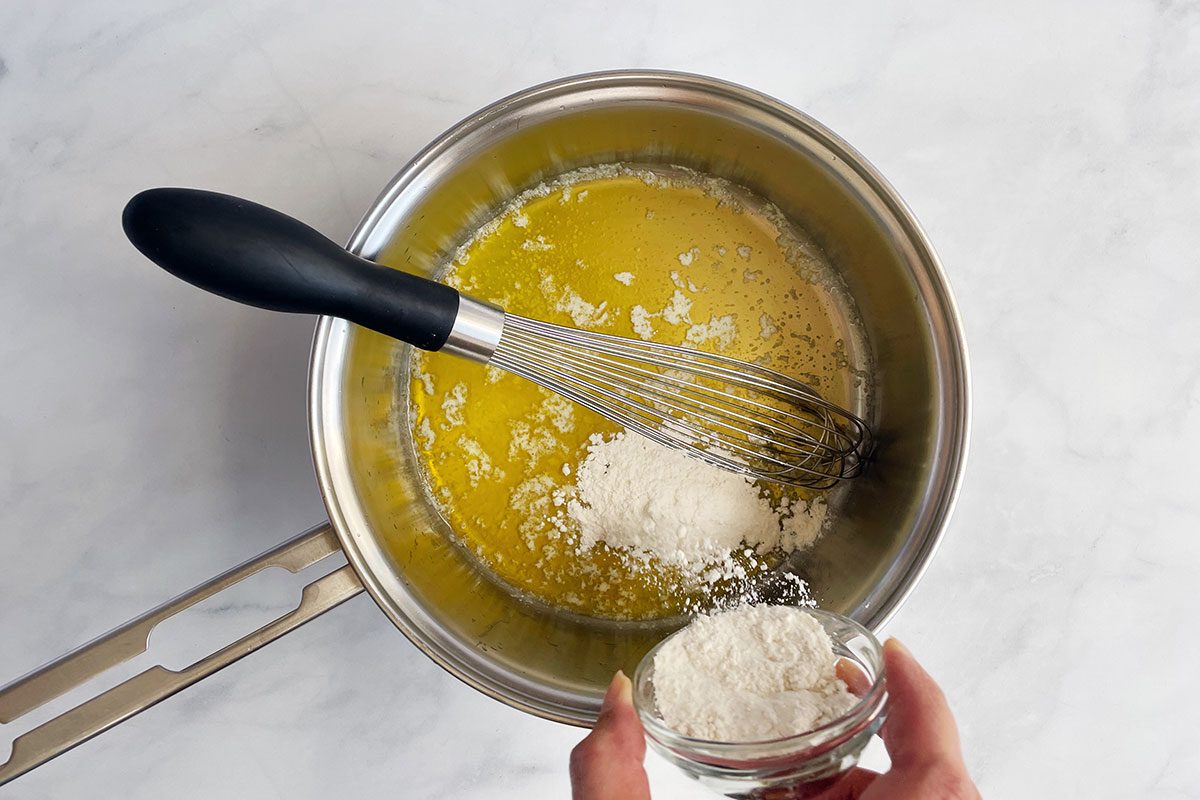 How to make Taste of Home's Cauliflower Gratin, step 1: combining butter and flour in a saucepan to form a roux