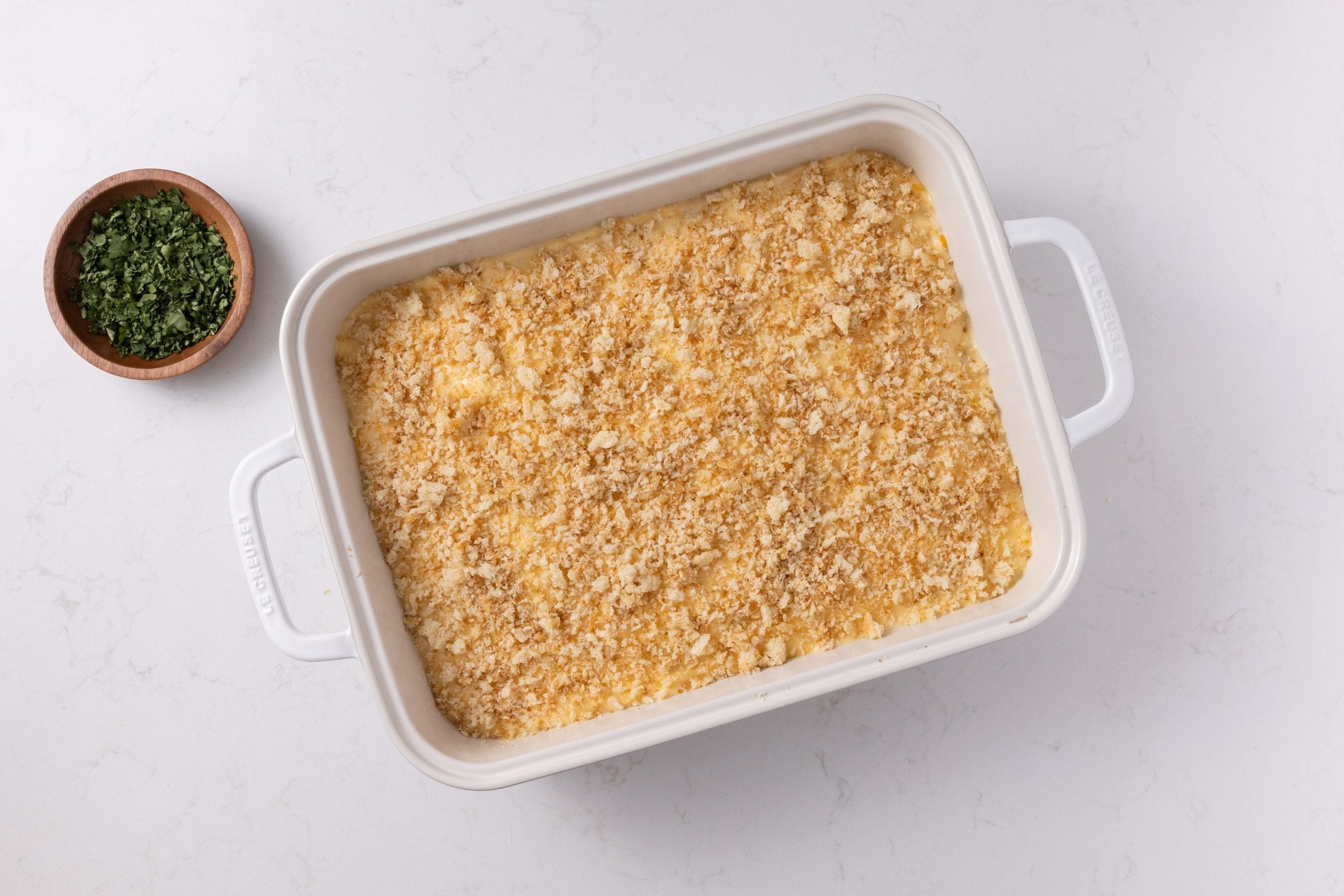Casserole in baking dish assembled and ready to be baked.