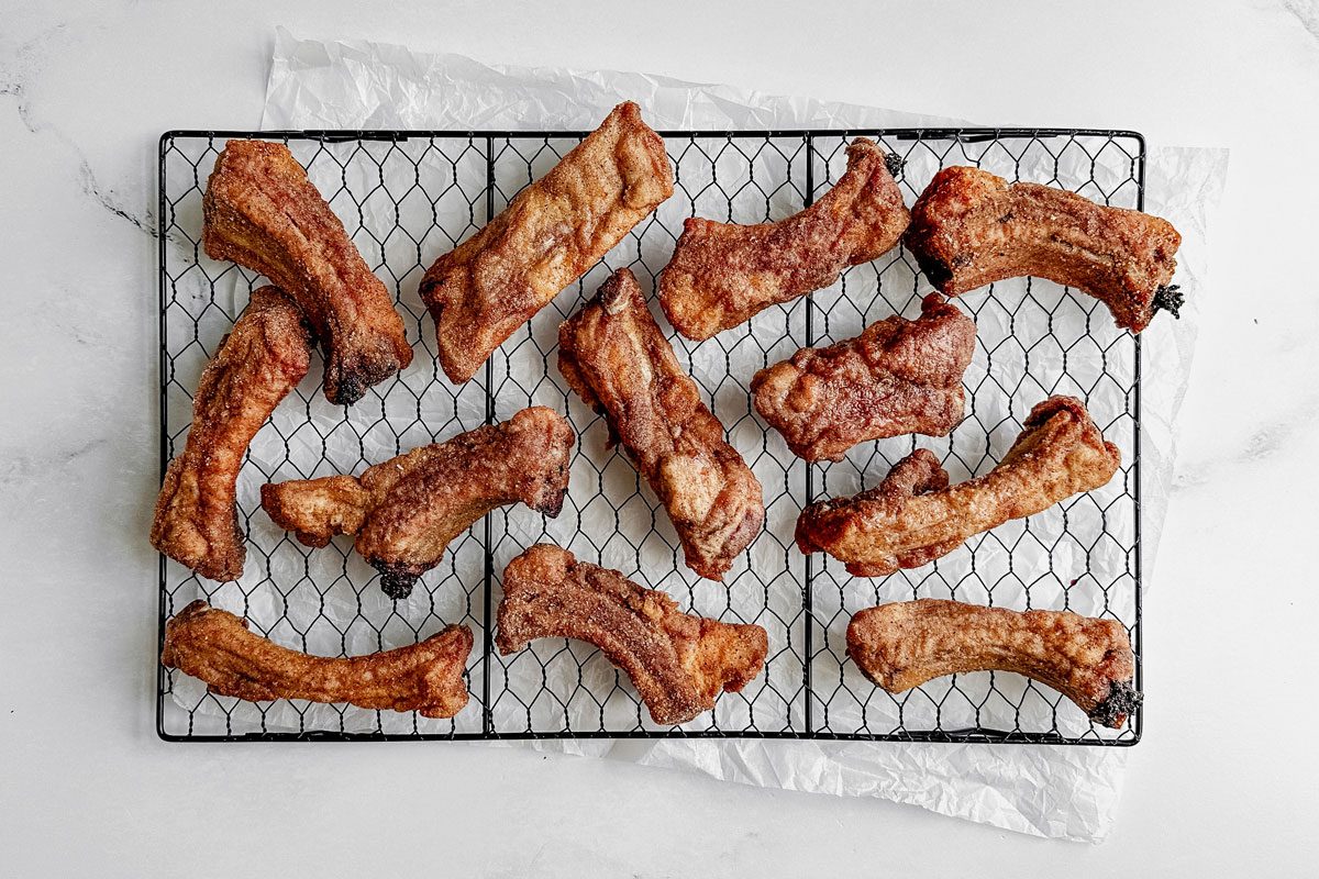 Taste Of Home Fried Ribs On A Wire Rack On A Marble Surface.
