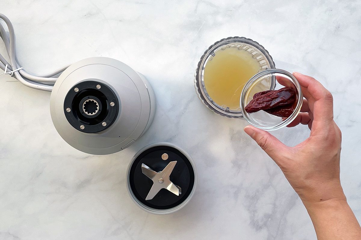 How to Make Hominy Soup, step 2 blend broth and chipotle peppers