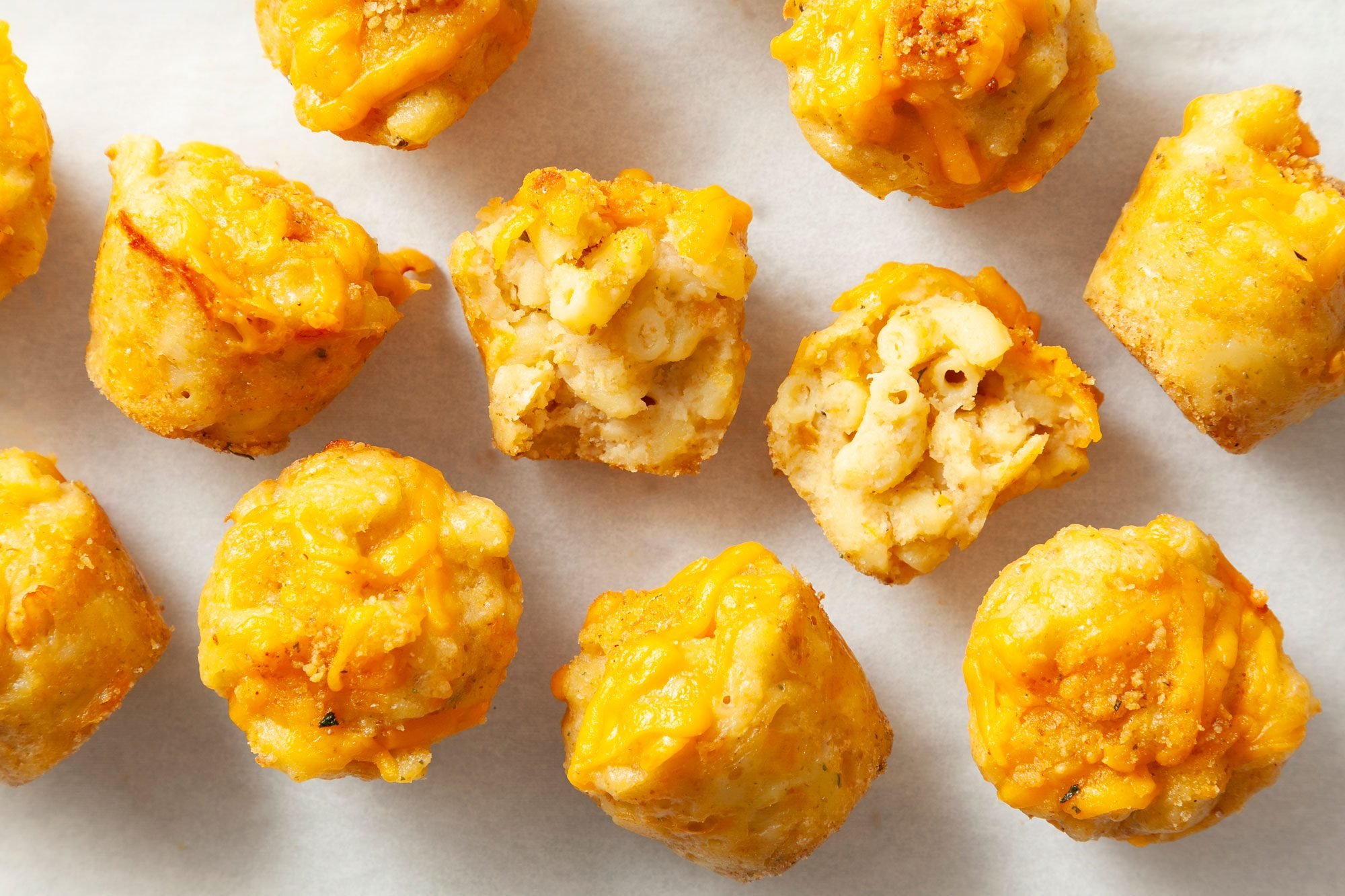 close shot of Mini Mac & Cheese Bites; white paper sheet;