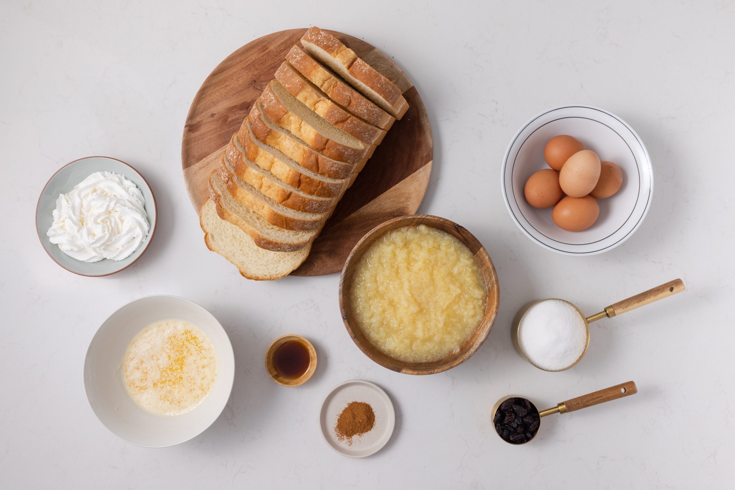 Ingredients for pineapple bread pudding on kitchen counter.