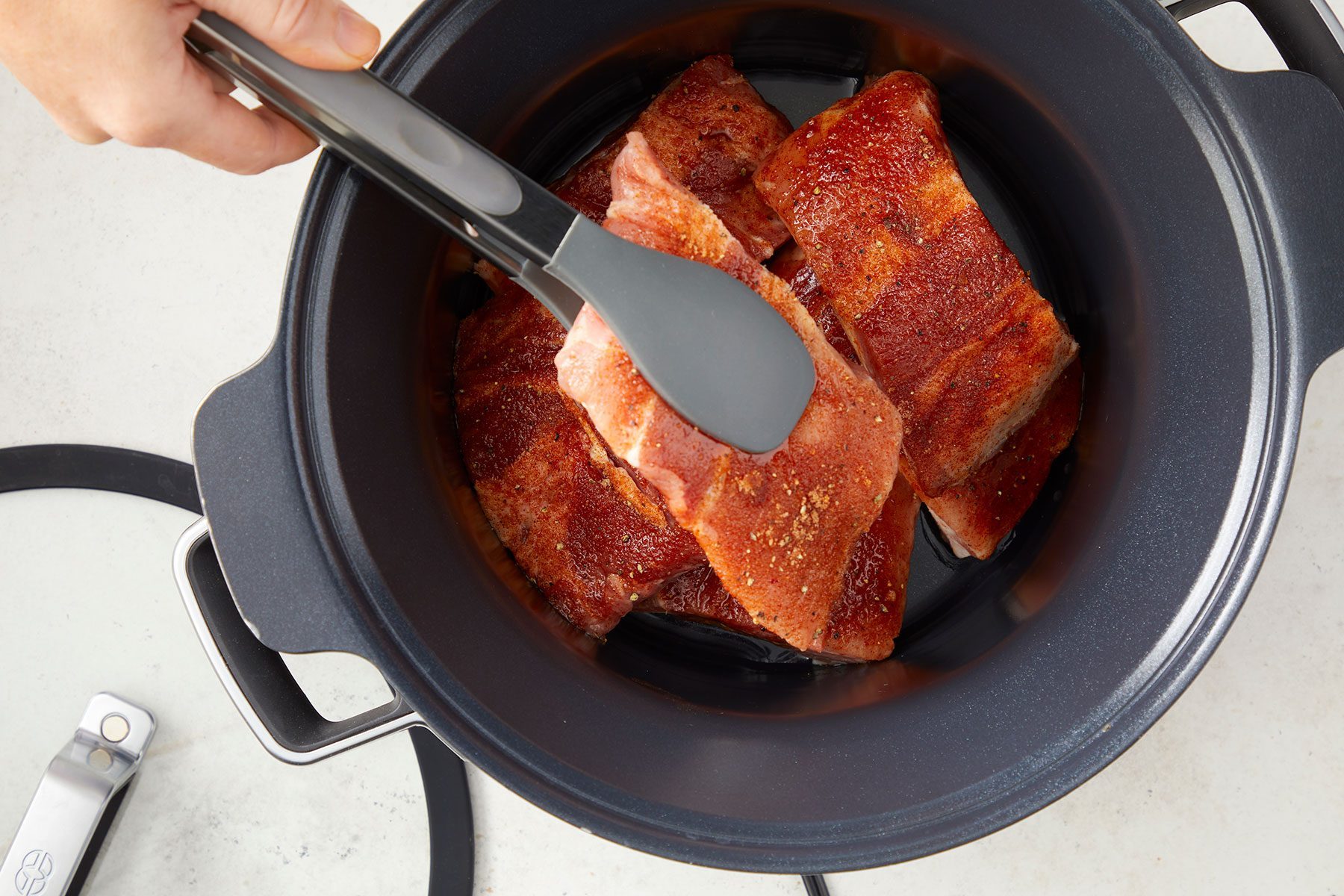 Overhead shot of rub with seasoning mixture; white chopping board; marble background