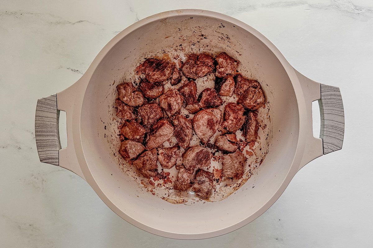 Browned venison in a Dutch oven for Taste of Home venison stew