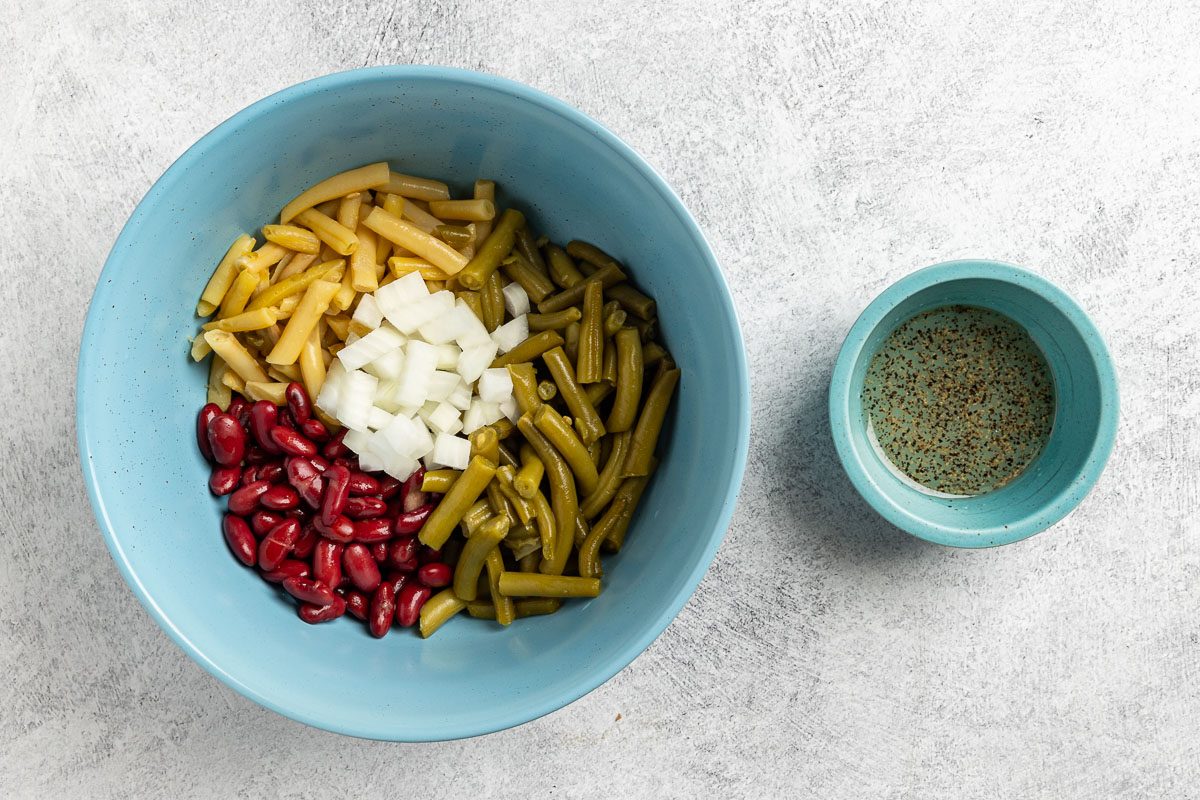 Taste of Home 3 Bean Salad recipe photo of combining all the ingredients to make the salad.