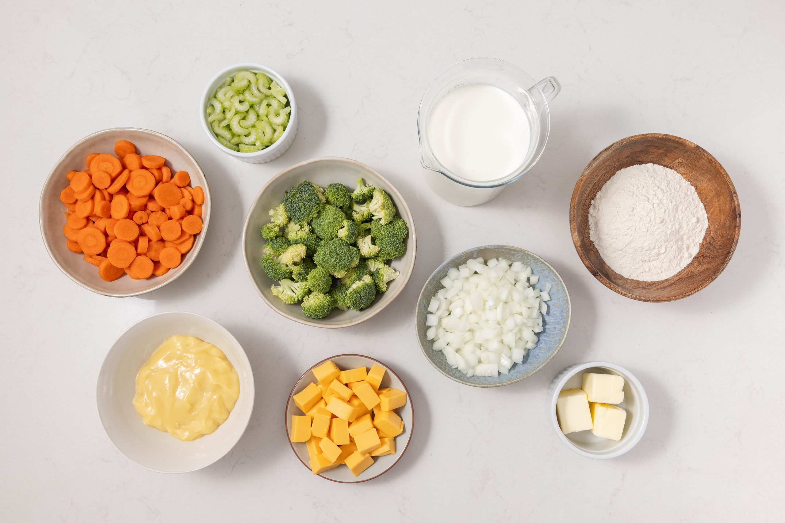 Ingredients for broccoli cheese soup in kitchen counter.