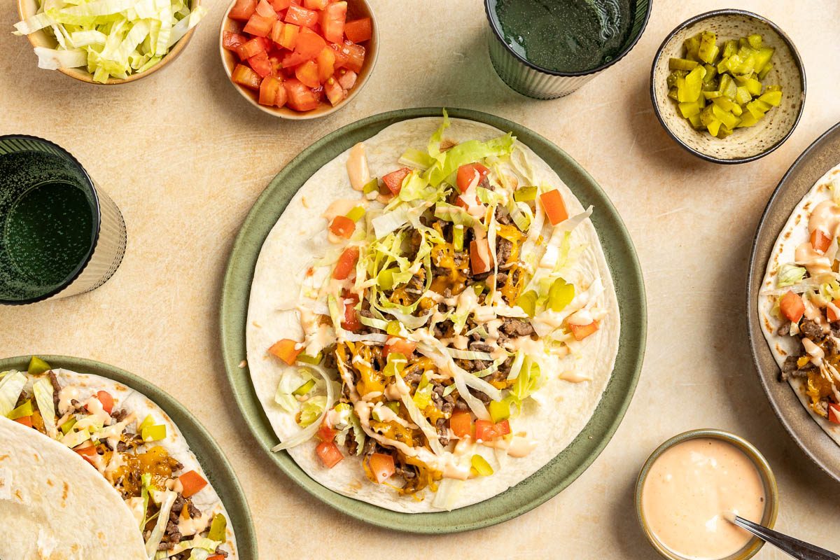 Taste of Home Cheeseburger Tacos recipe photo of the finished recipe served on plates.